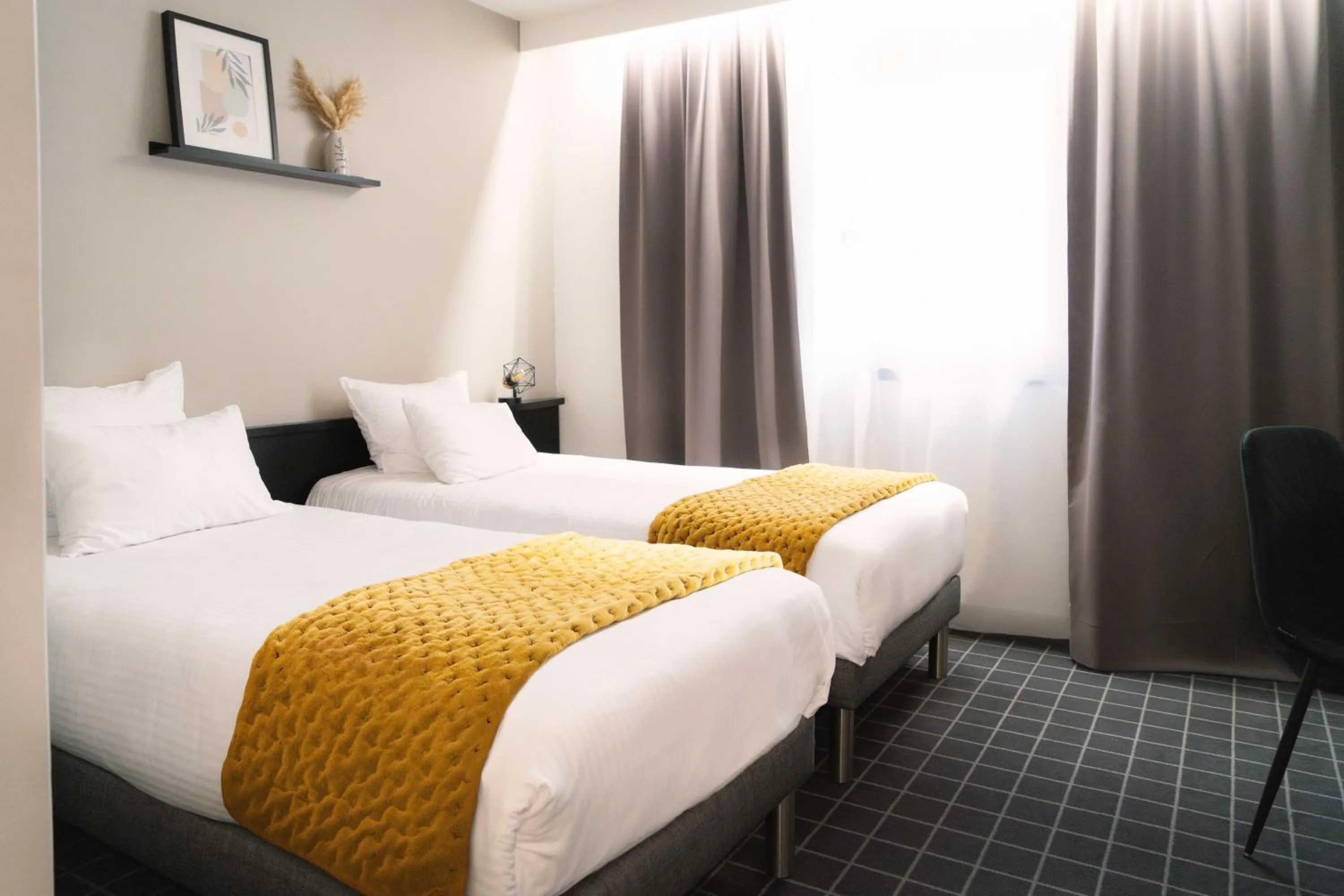 Bed in Hôtel du Beffroi Gravelines Dunkerque