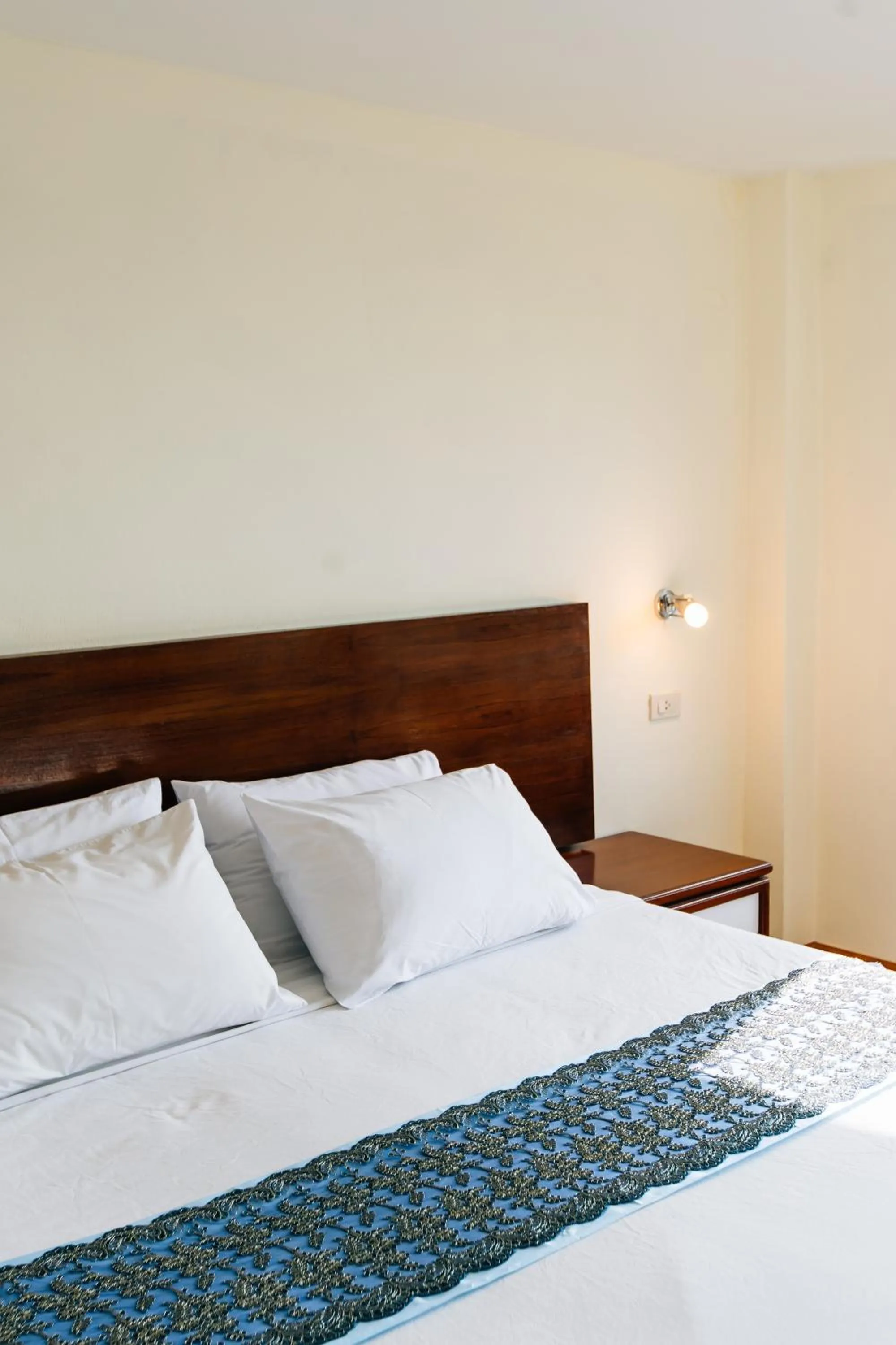 Bed in Sinkiat Thani Hotel