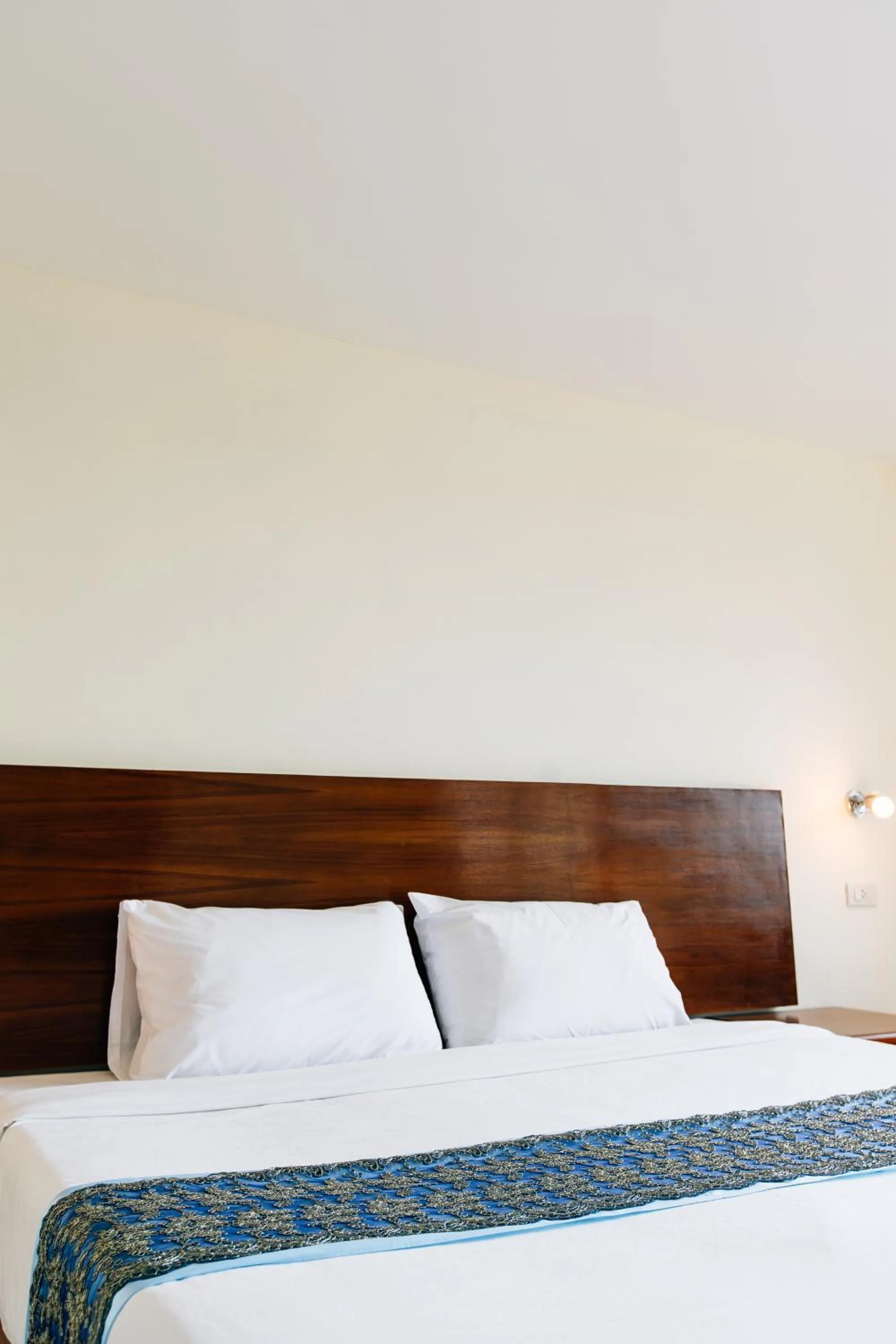 Bed in Sinkiat Thani Hotel