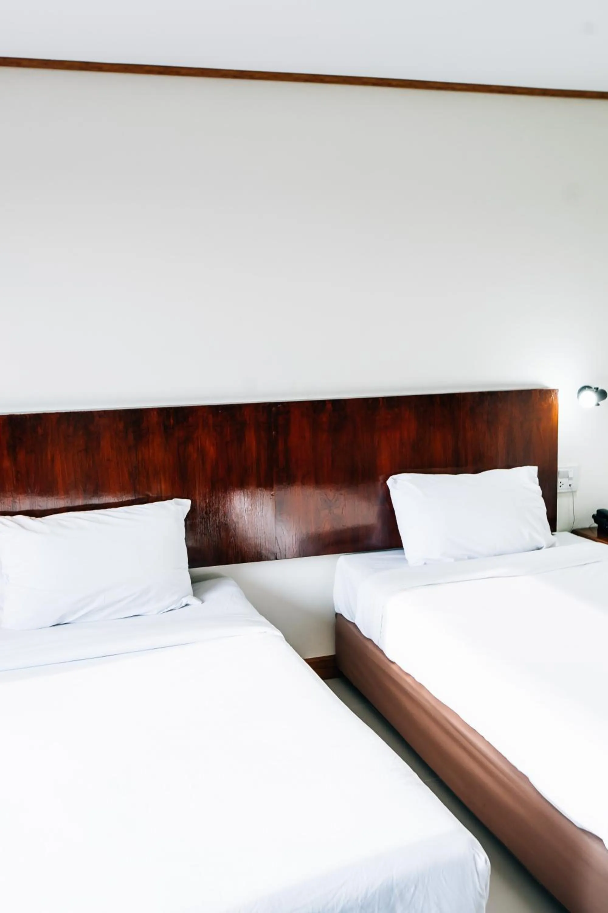 Bed in Sinkiat Thani Hotel