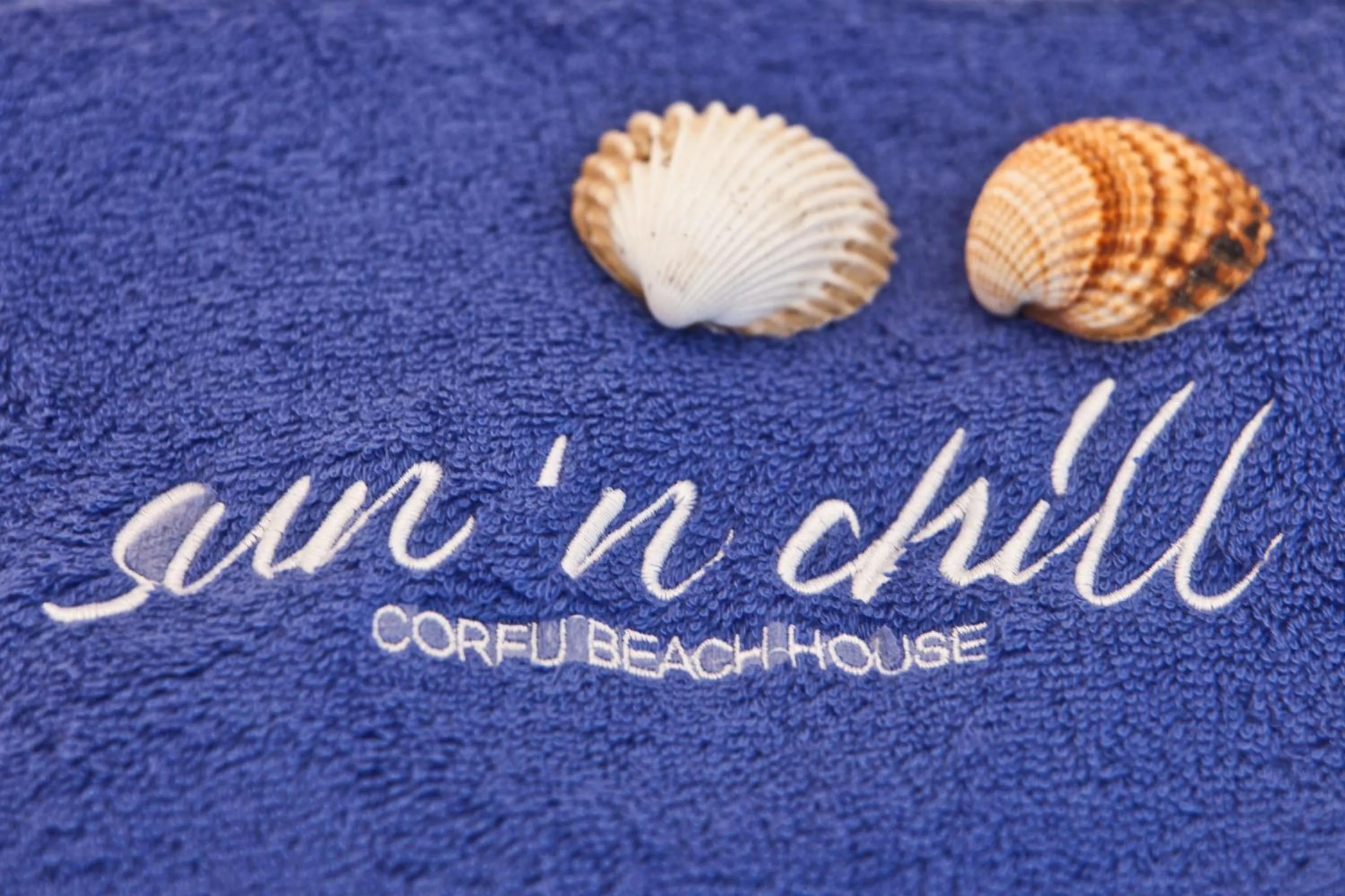 Property logo or sign in Sun 'n Chill, Boutique Apartments & Beach Villa