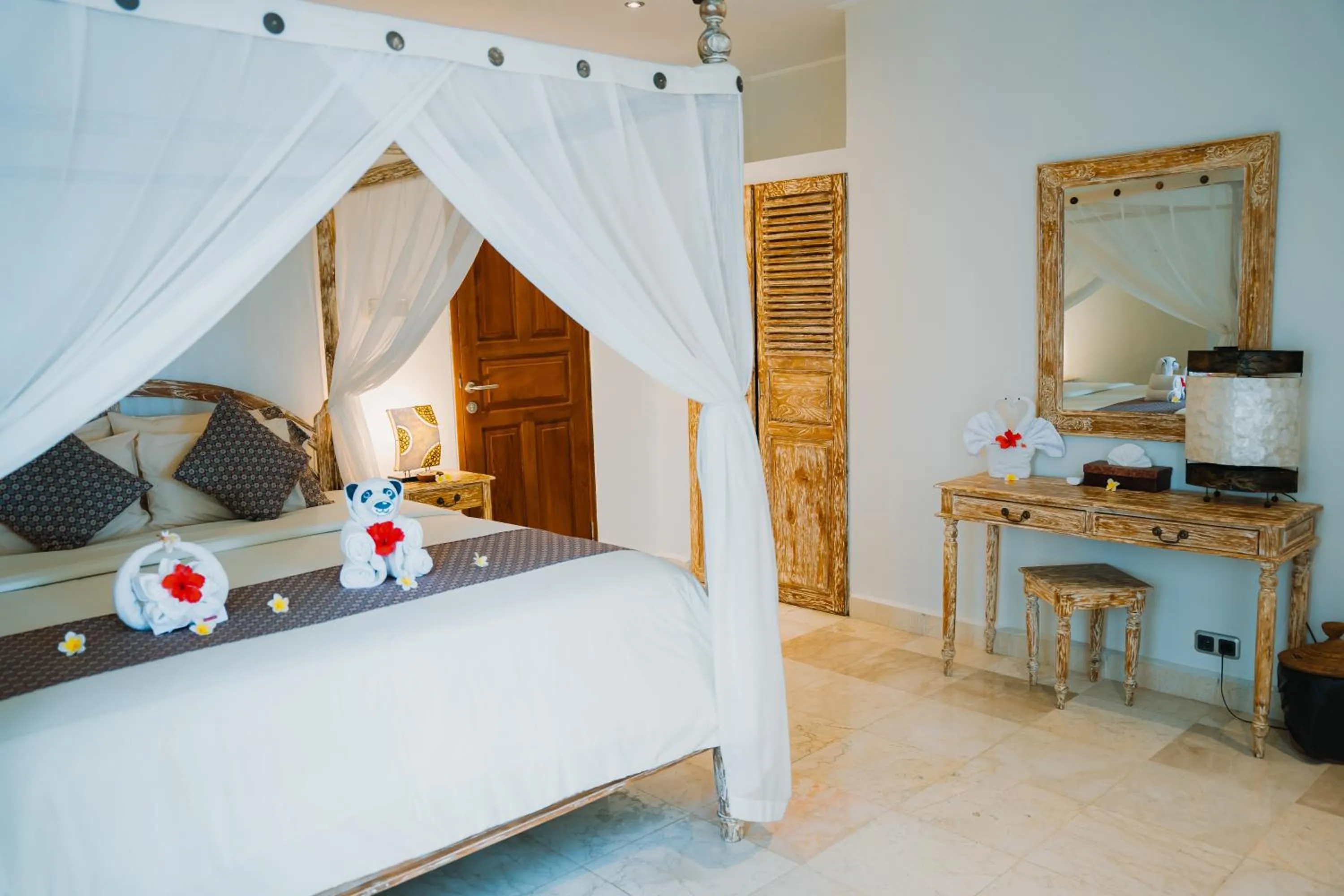 Bed in Puri Wirata Dive Resort and Spa Amed