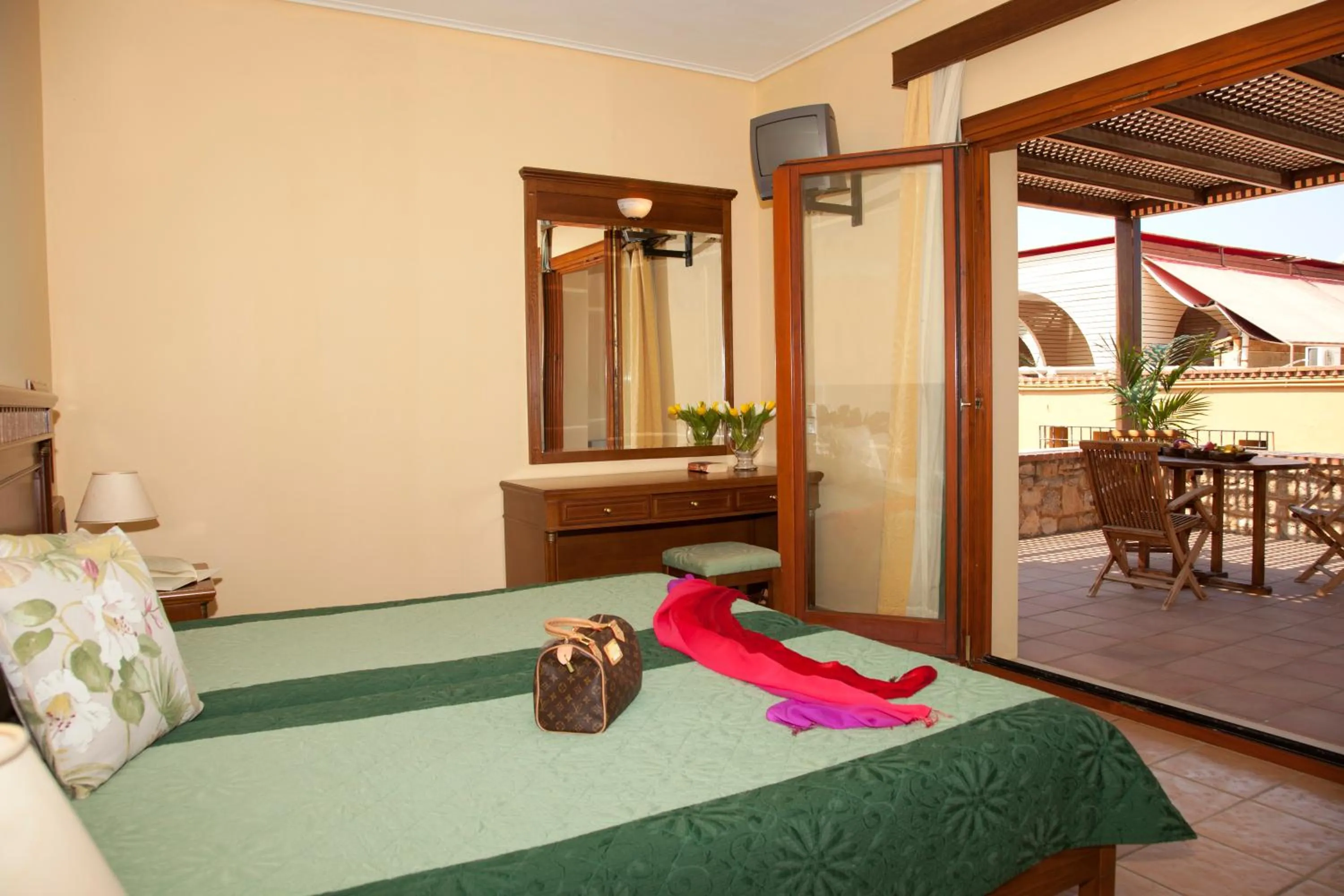 Bed in Mylos Hotel Apartments