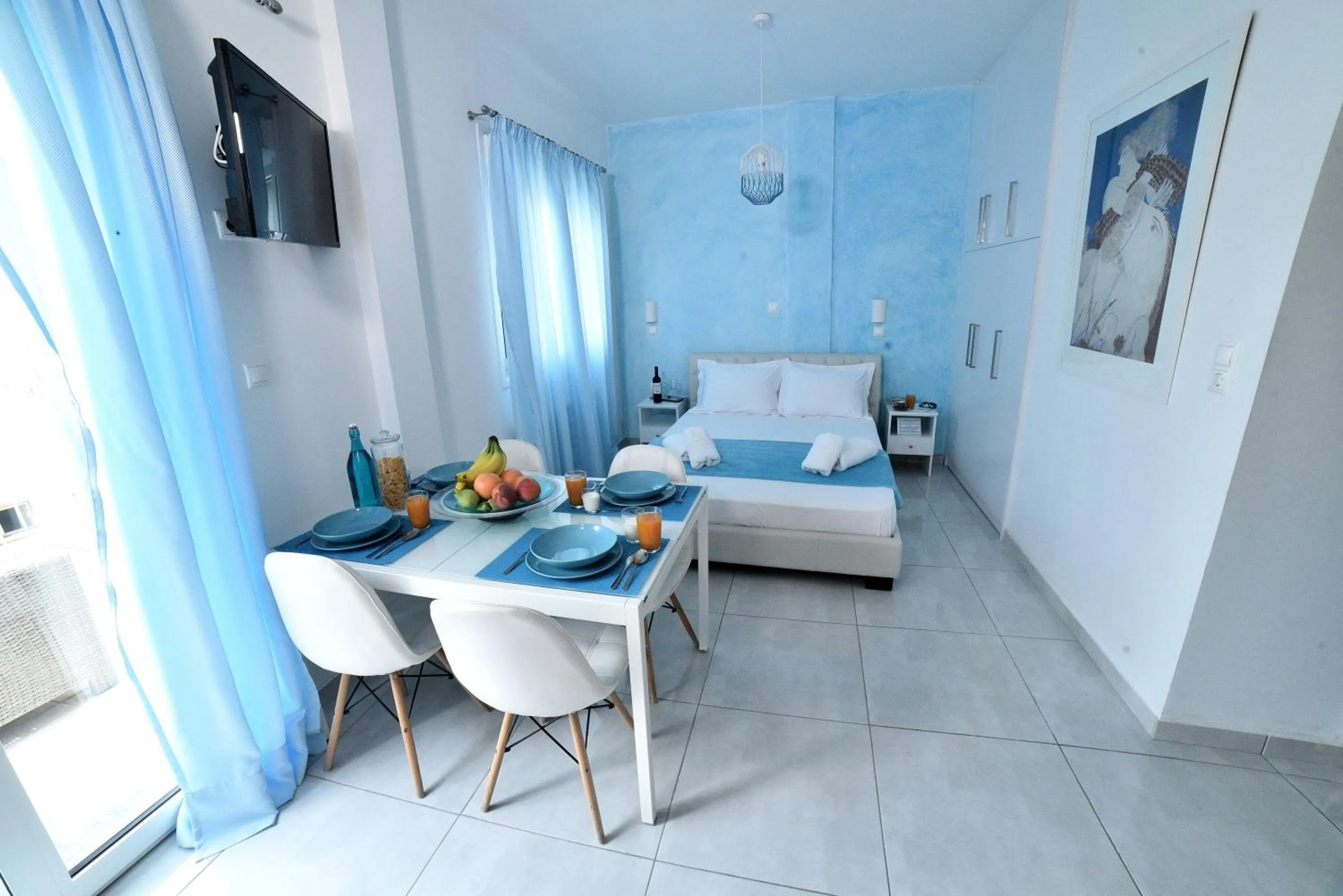 Dining area, Bed in Central Athens Studios