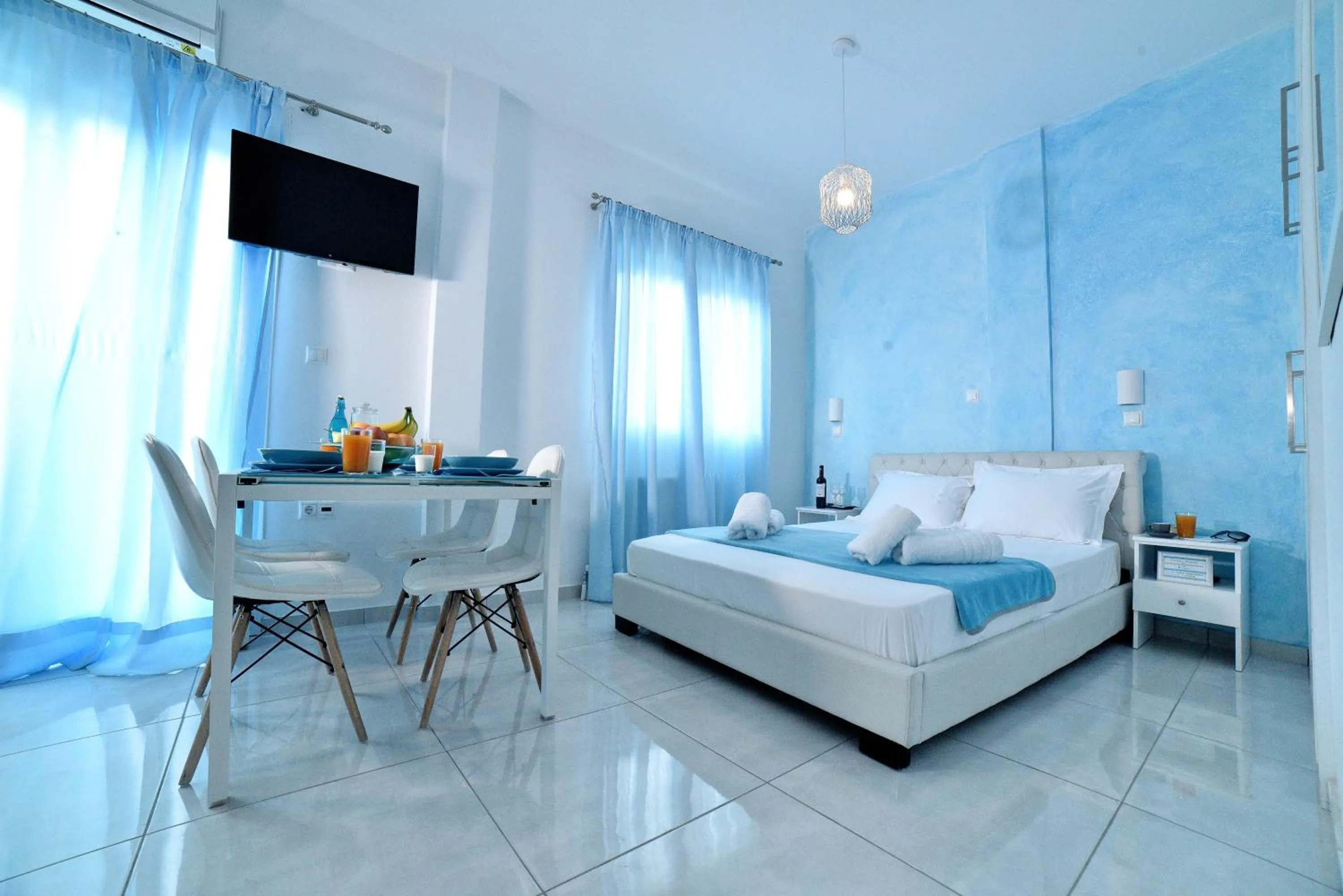 Dining area, Bed in Central Athens Studios