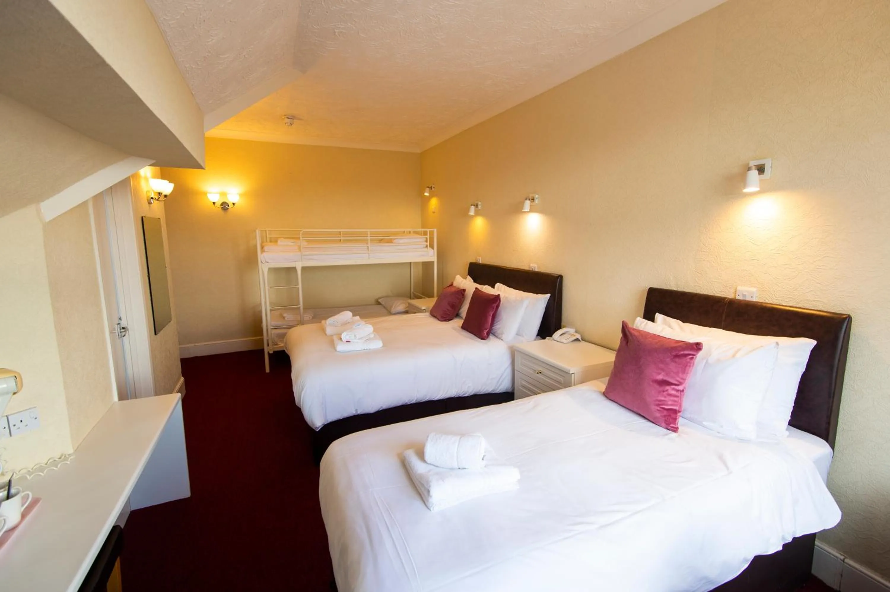 Bed in Palm Court Hotel