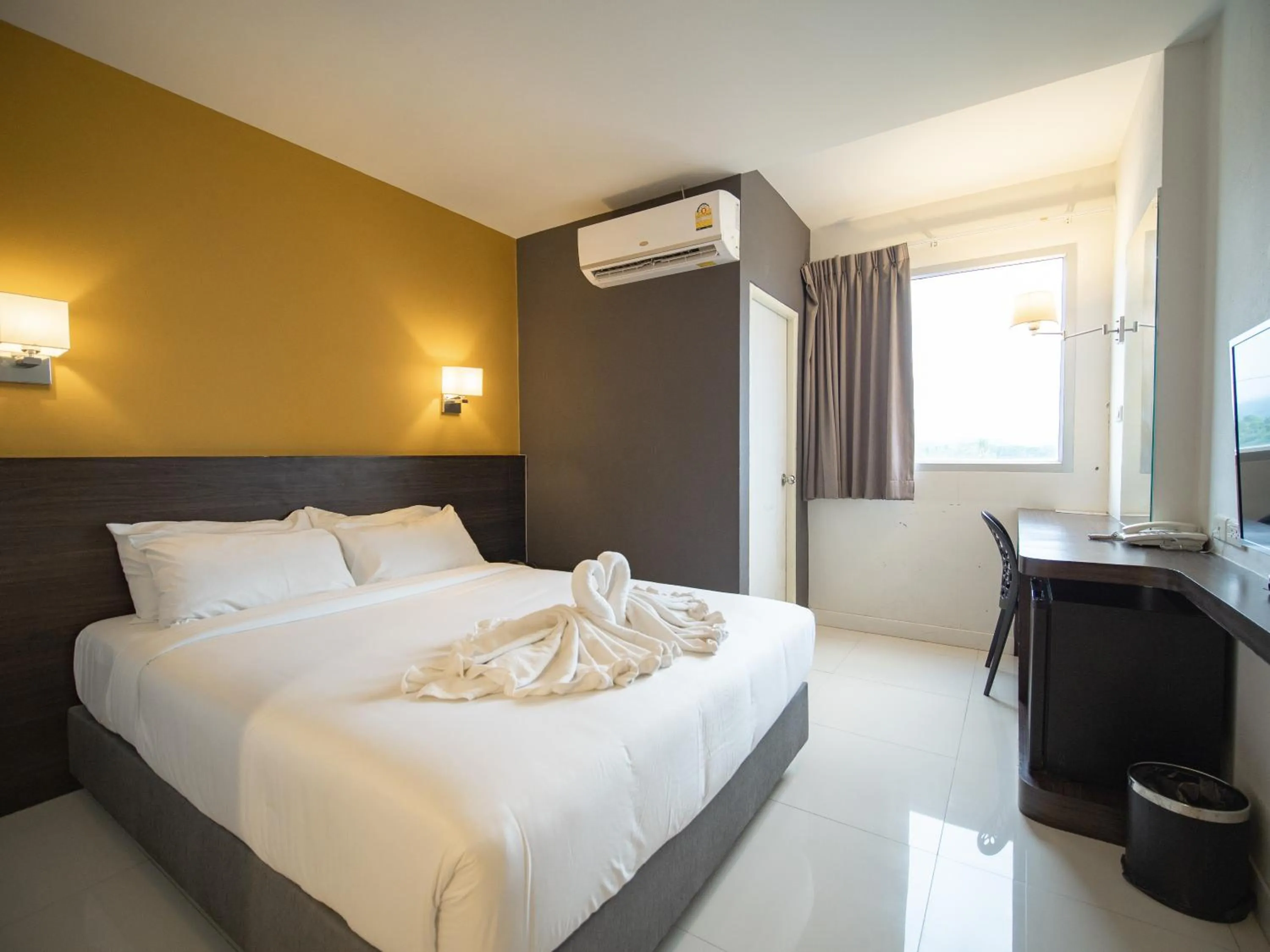 Bed in Fortune D Hotel Loei
