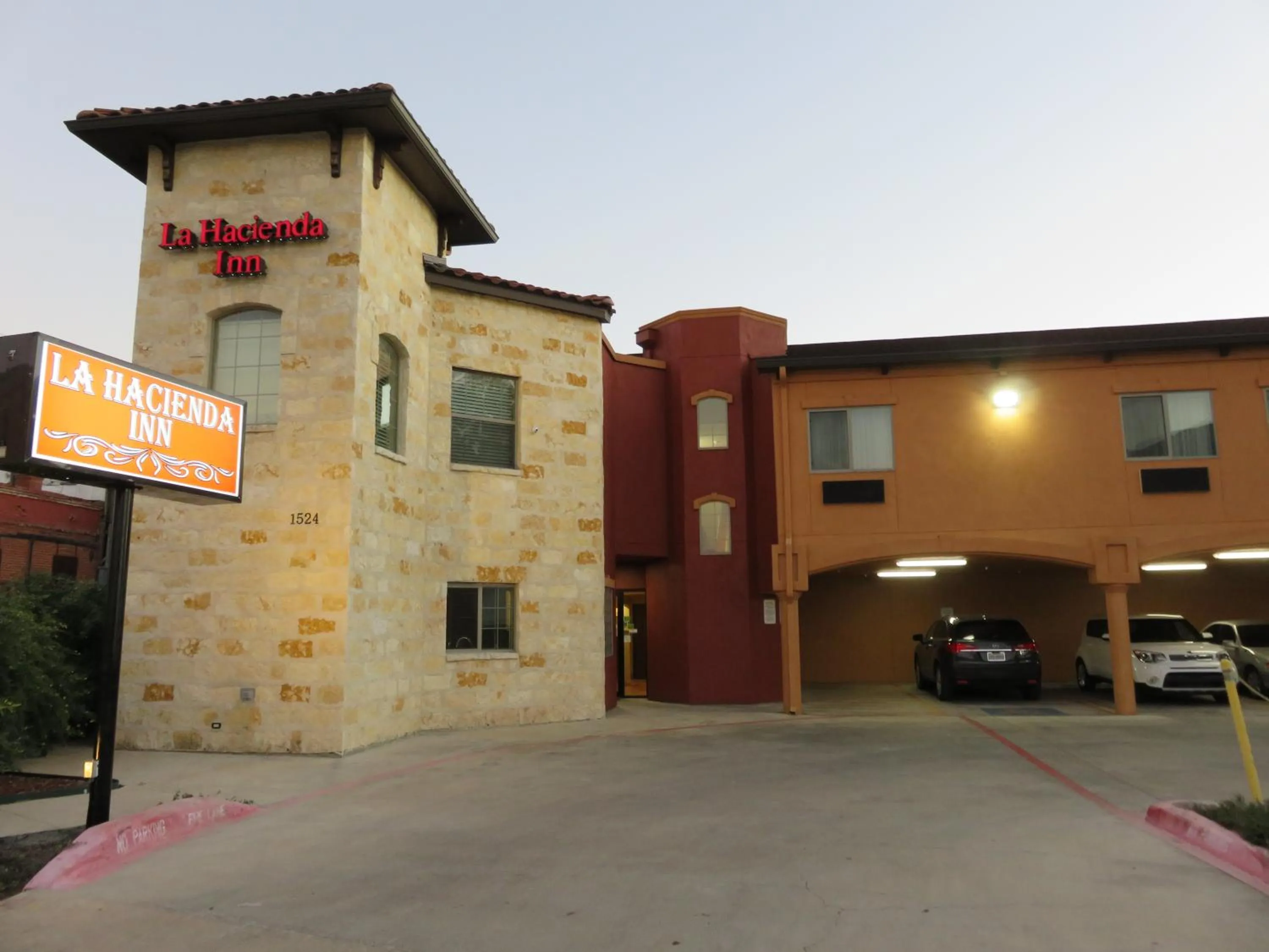 Property logo or sign in La Hacienda Inn near Alamodome & Riverwalk