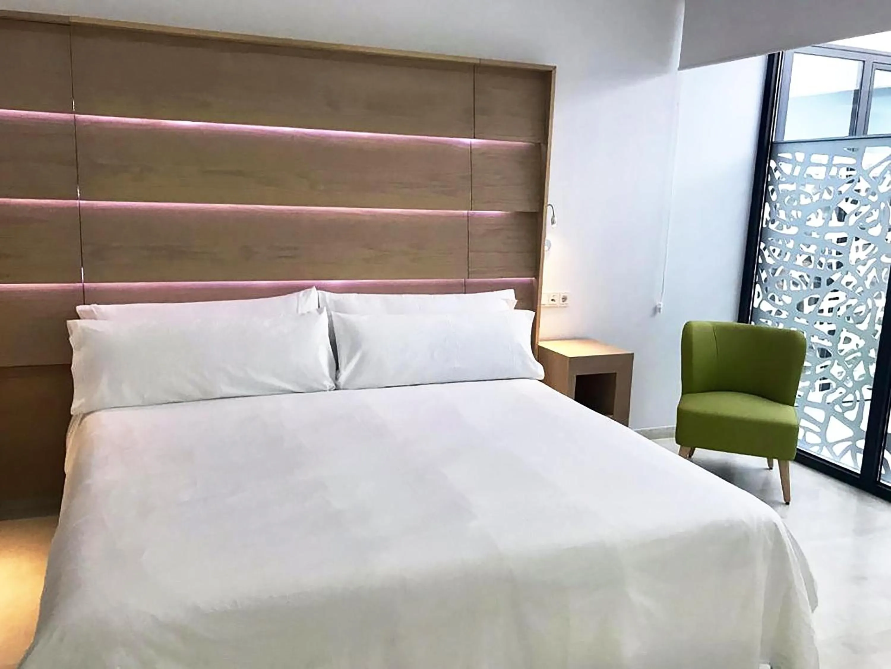 Bed in Feelathome Rivero Apartments