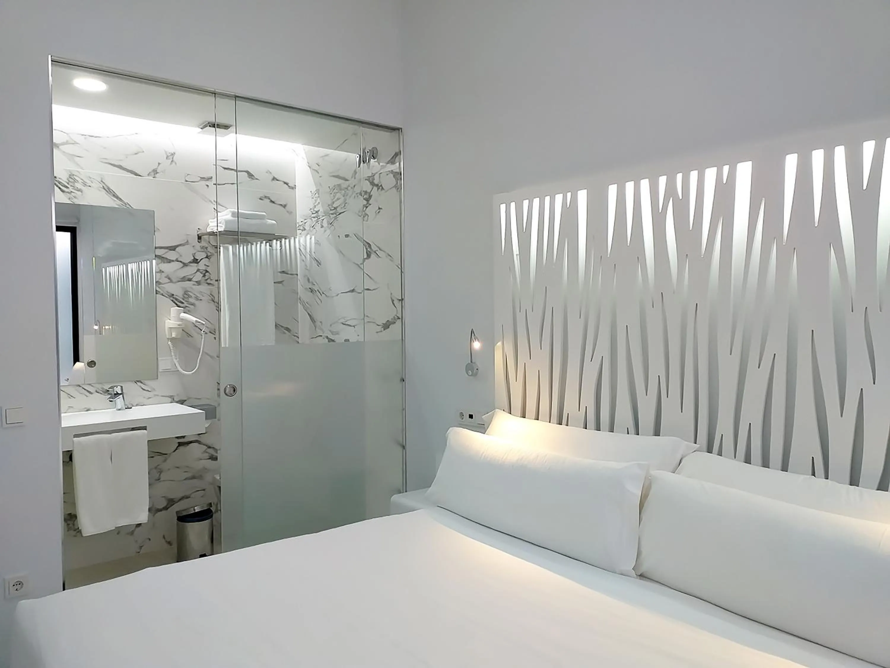 Bed in Feelathome Rivero Apartments