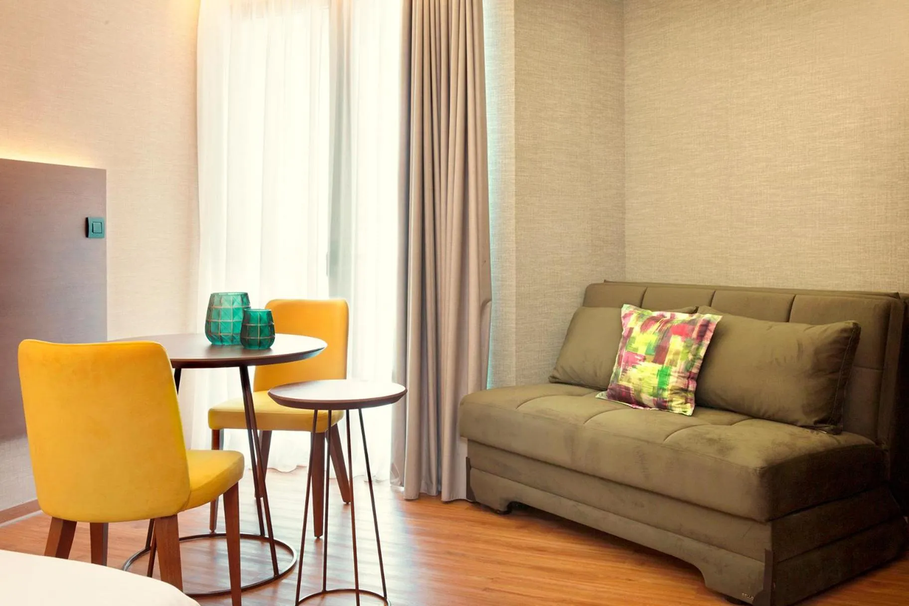 Seating area in Zeus Essence Wyndham Athens Residence