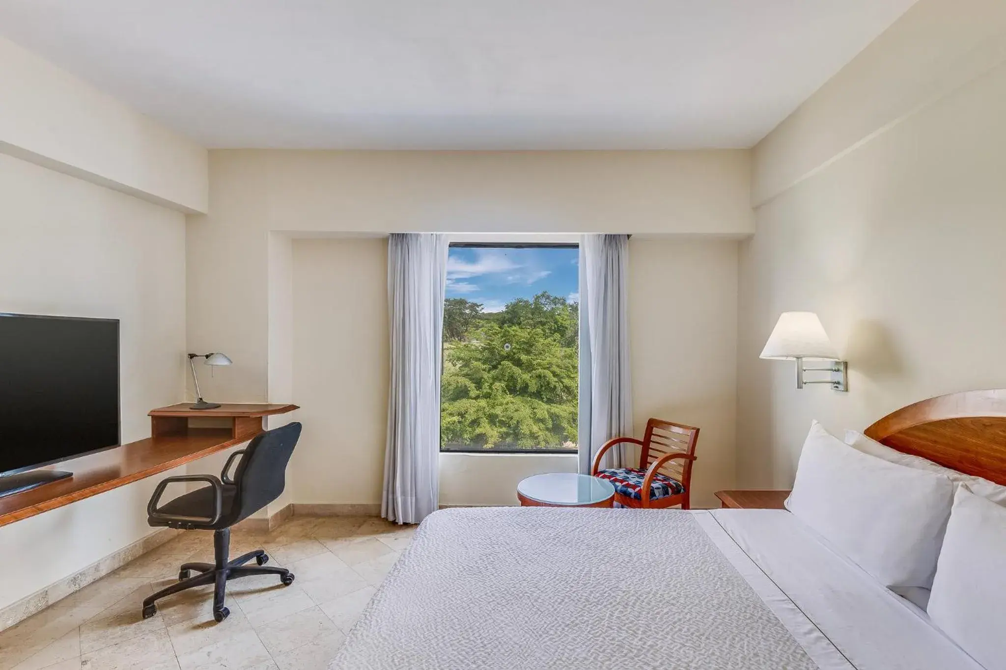 Photo of the whole room, Bed in Fiesta Inn Colima Photo of the whole room, Bed in Fiesta Inn Colima