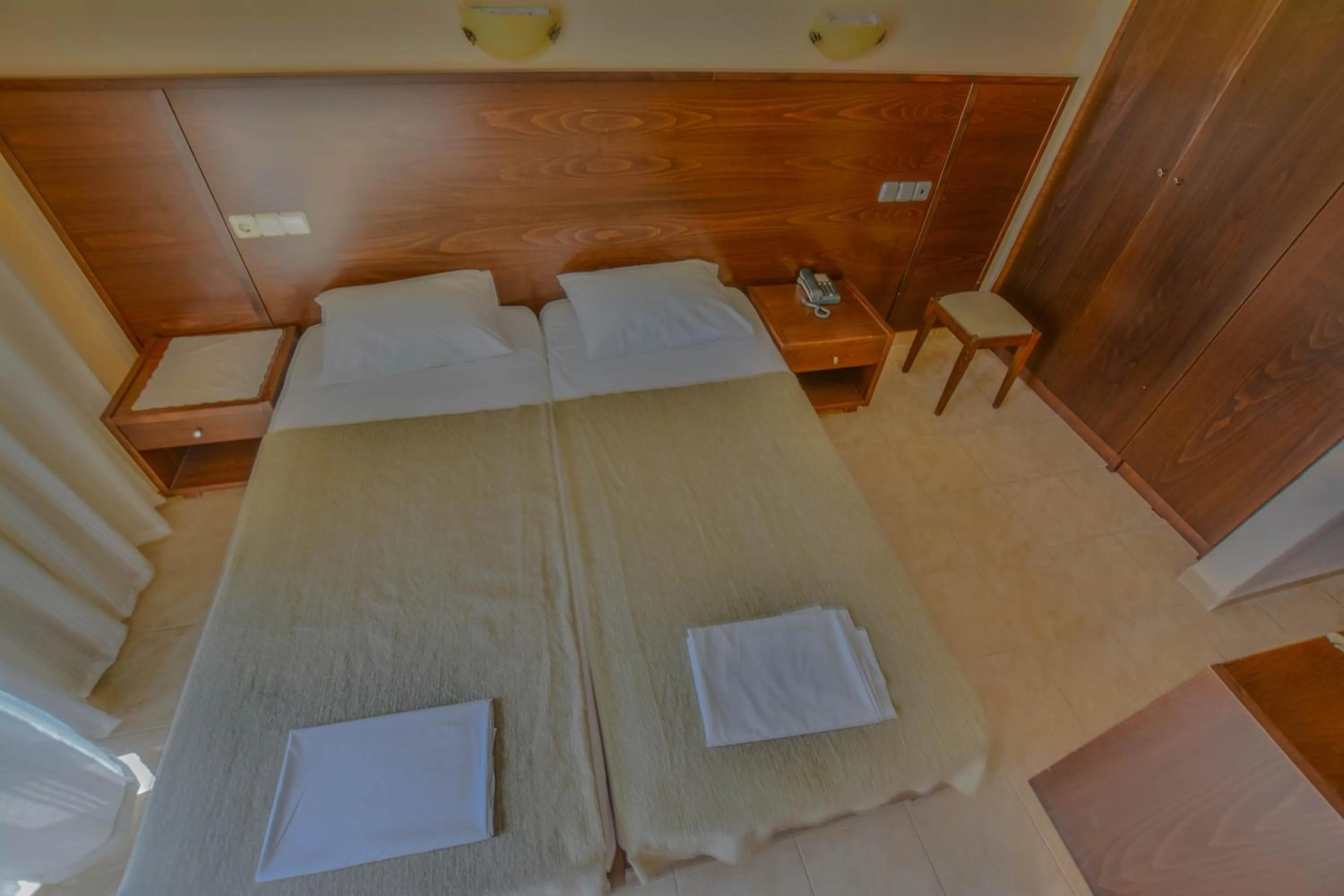 Bed in Hotel Achillion