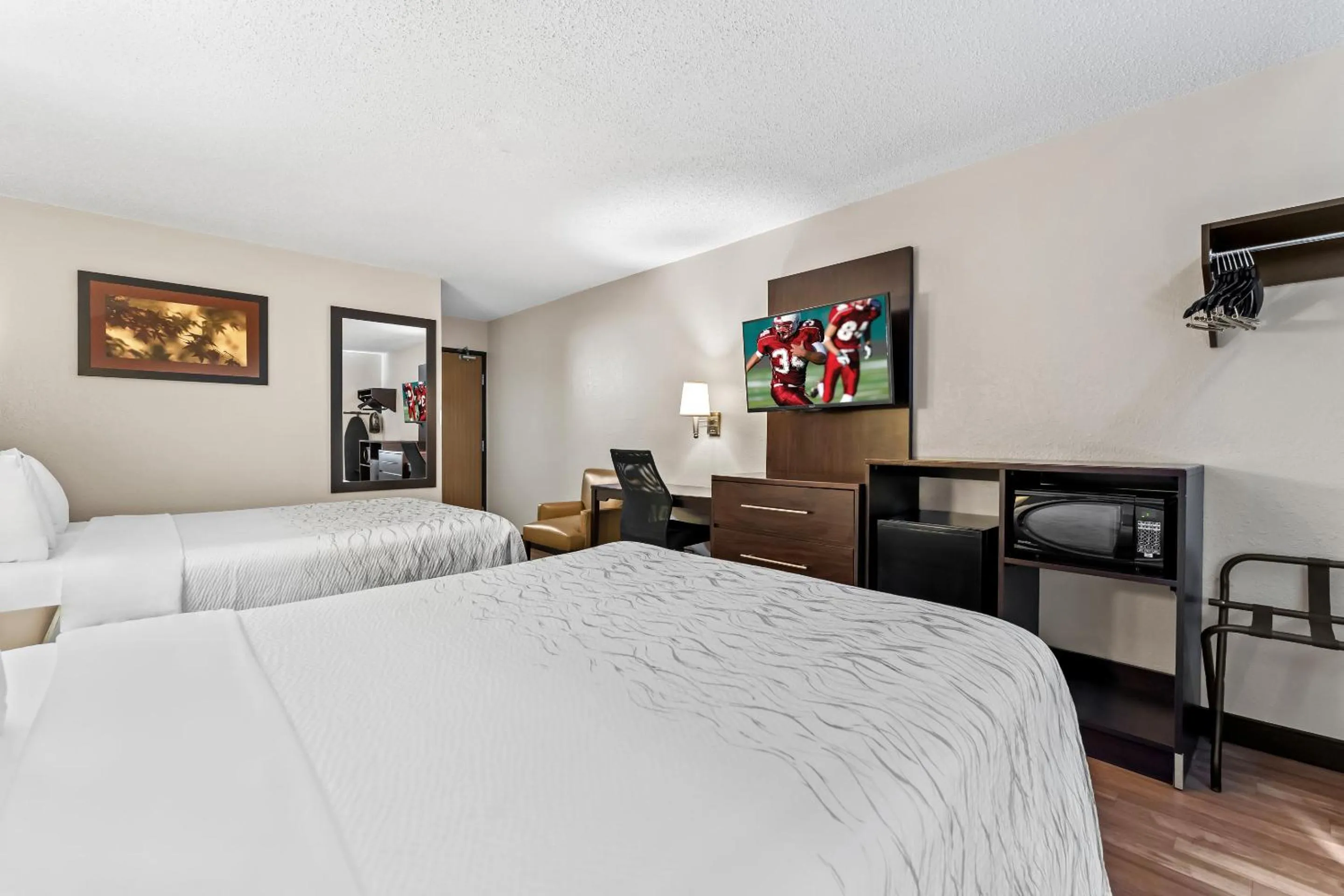 Bed in Red Roof Inn PLUS+ & Suites Malone