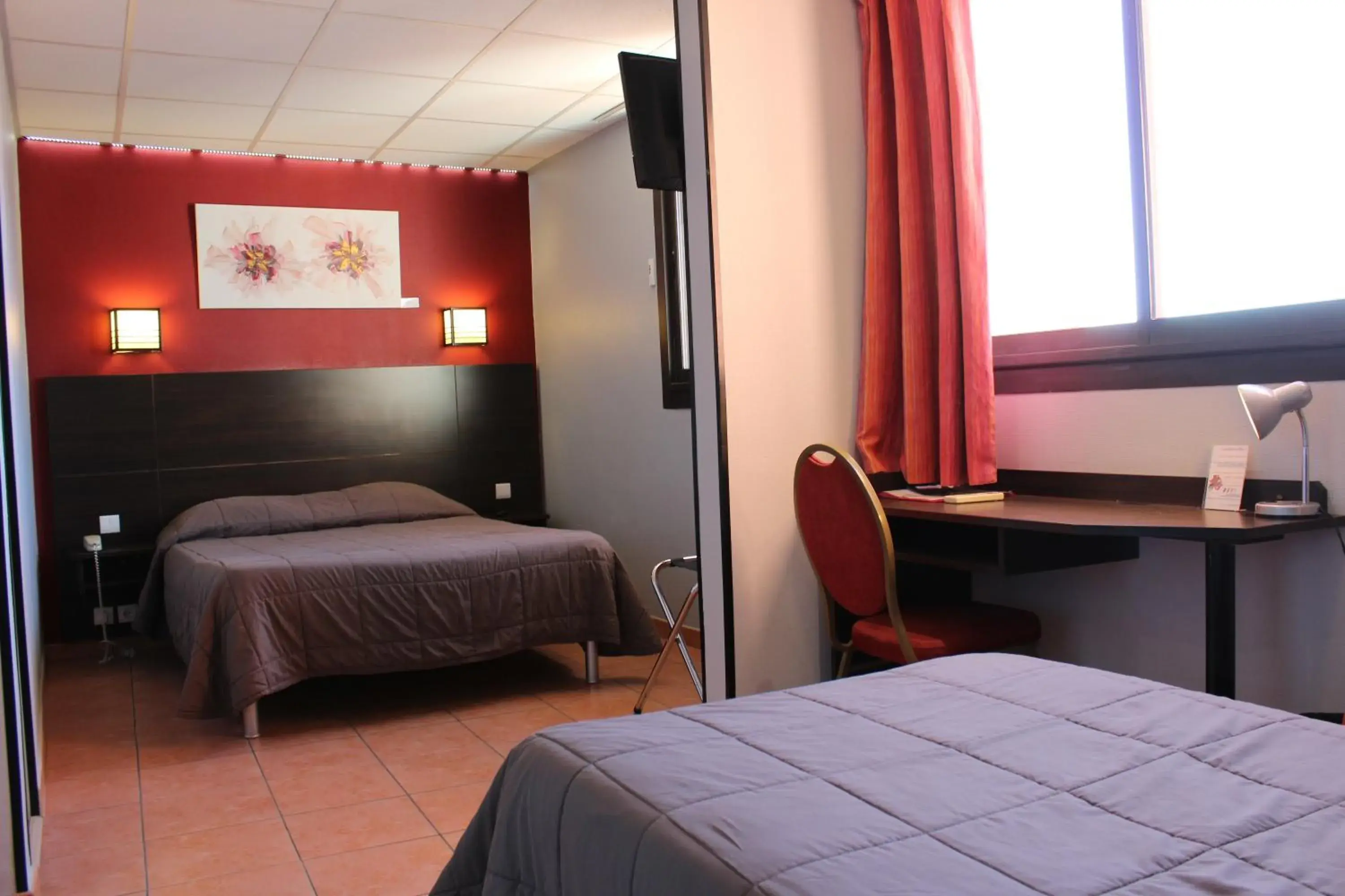 Bed in Hôtel L'Hacienda Bed in Hôtel L'Hacienda