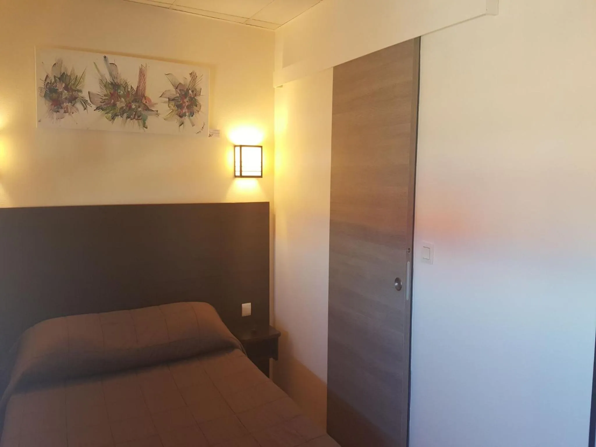 Bed in Hôtel L'Hacienda