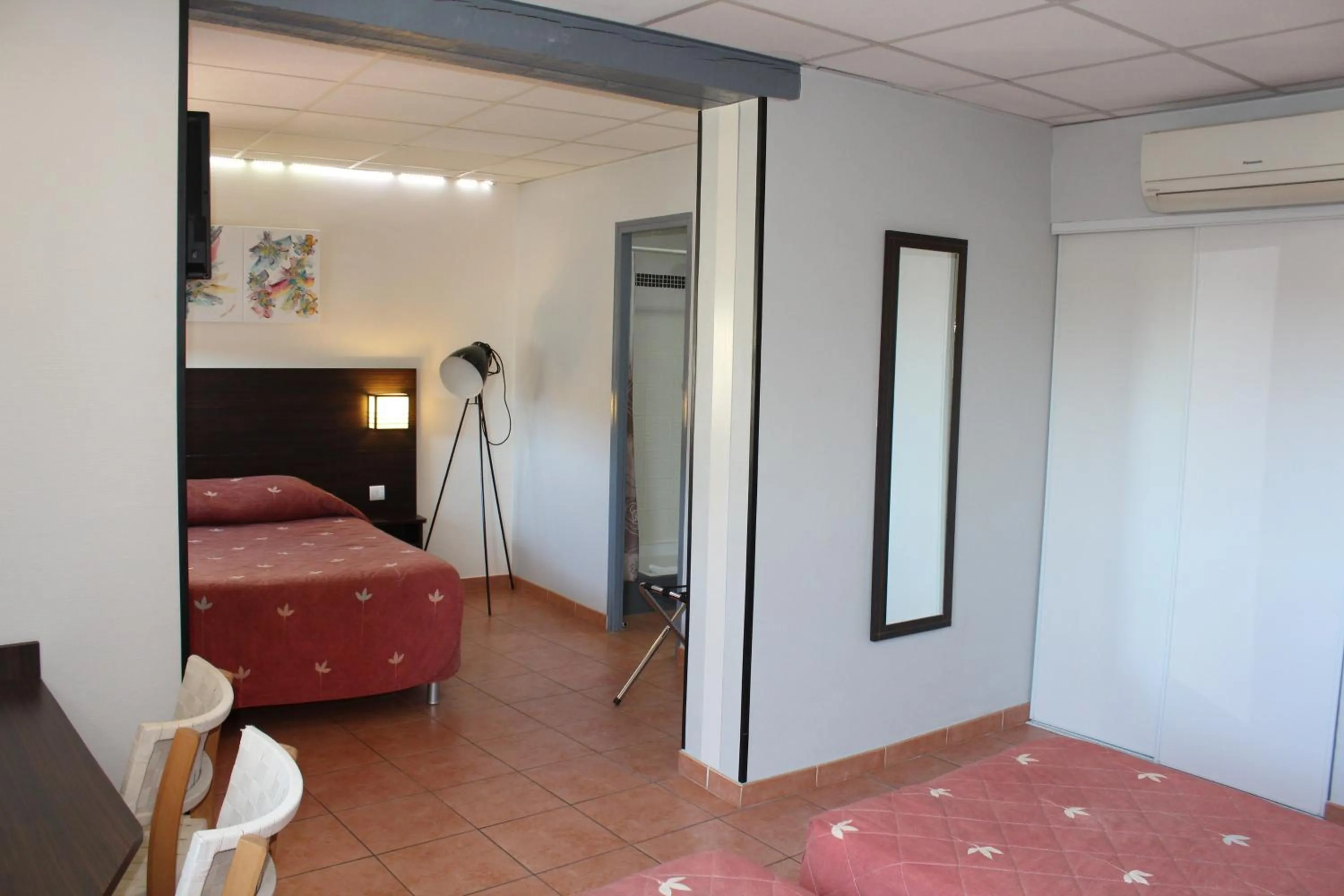 Bed in Hôtel L'Hacienda