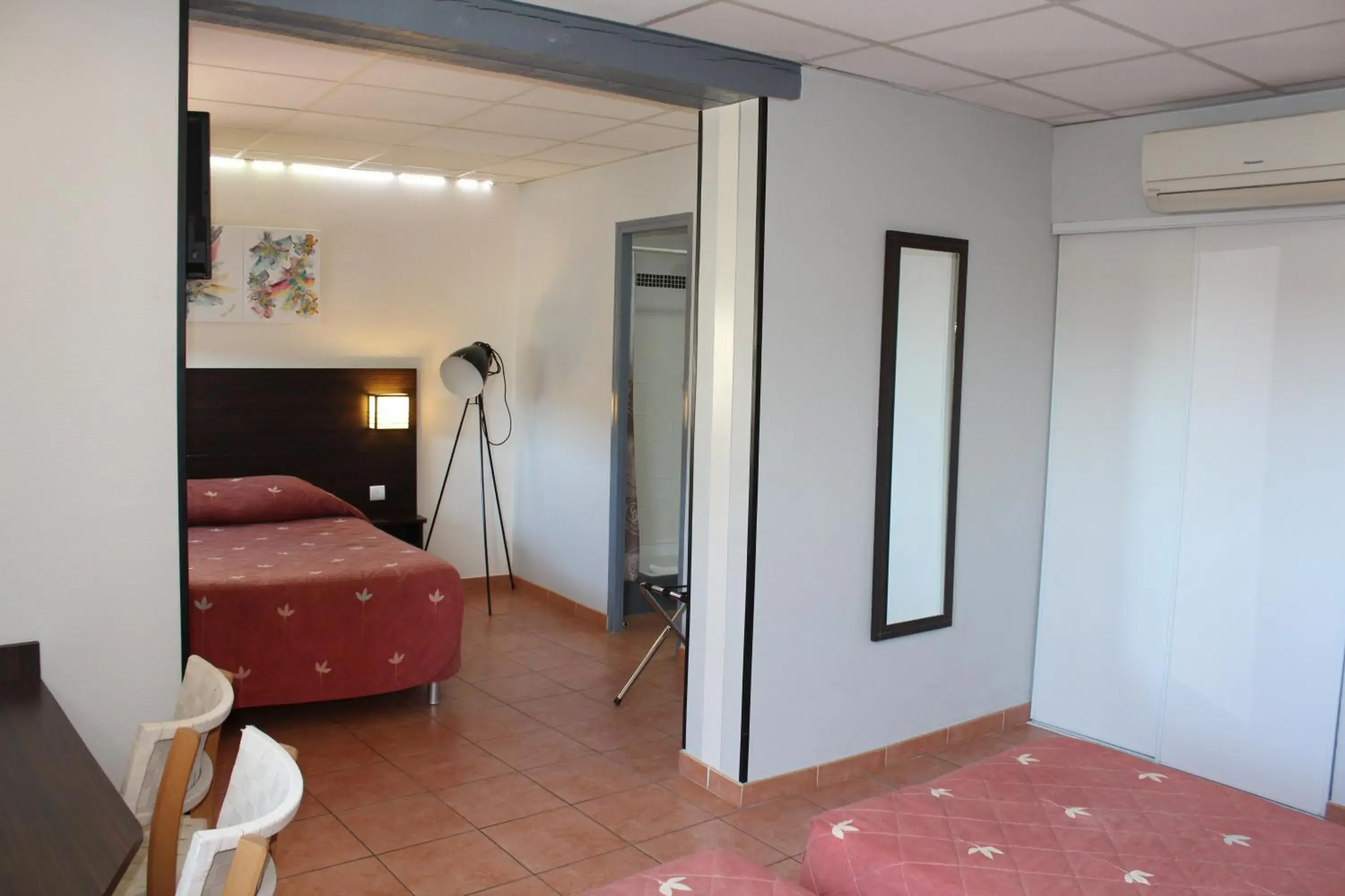 Bed in Hôtel L'Hacienda Bed in Hôtel L'Hacienda