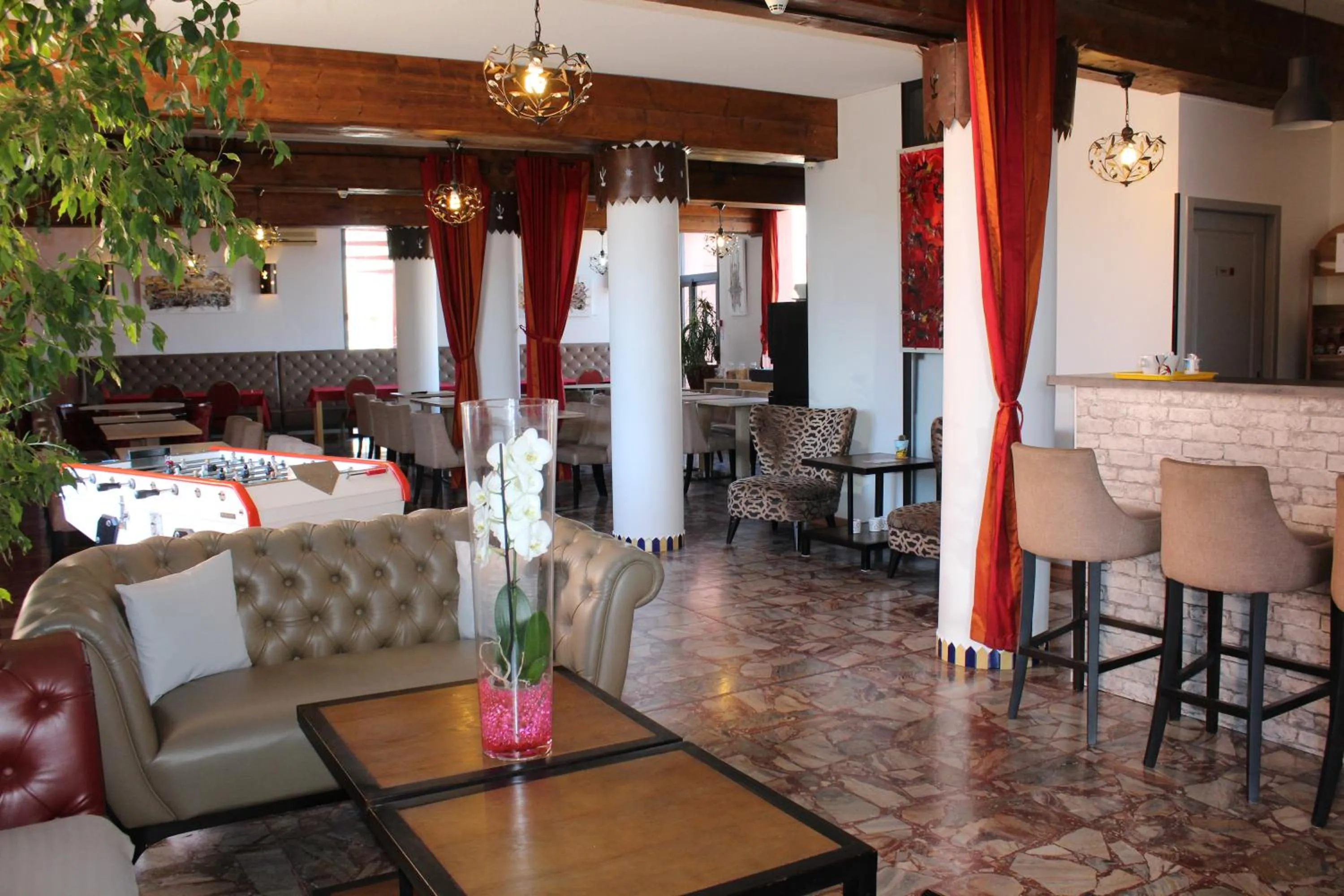 Living room in Hôtel L'Hacienda