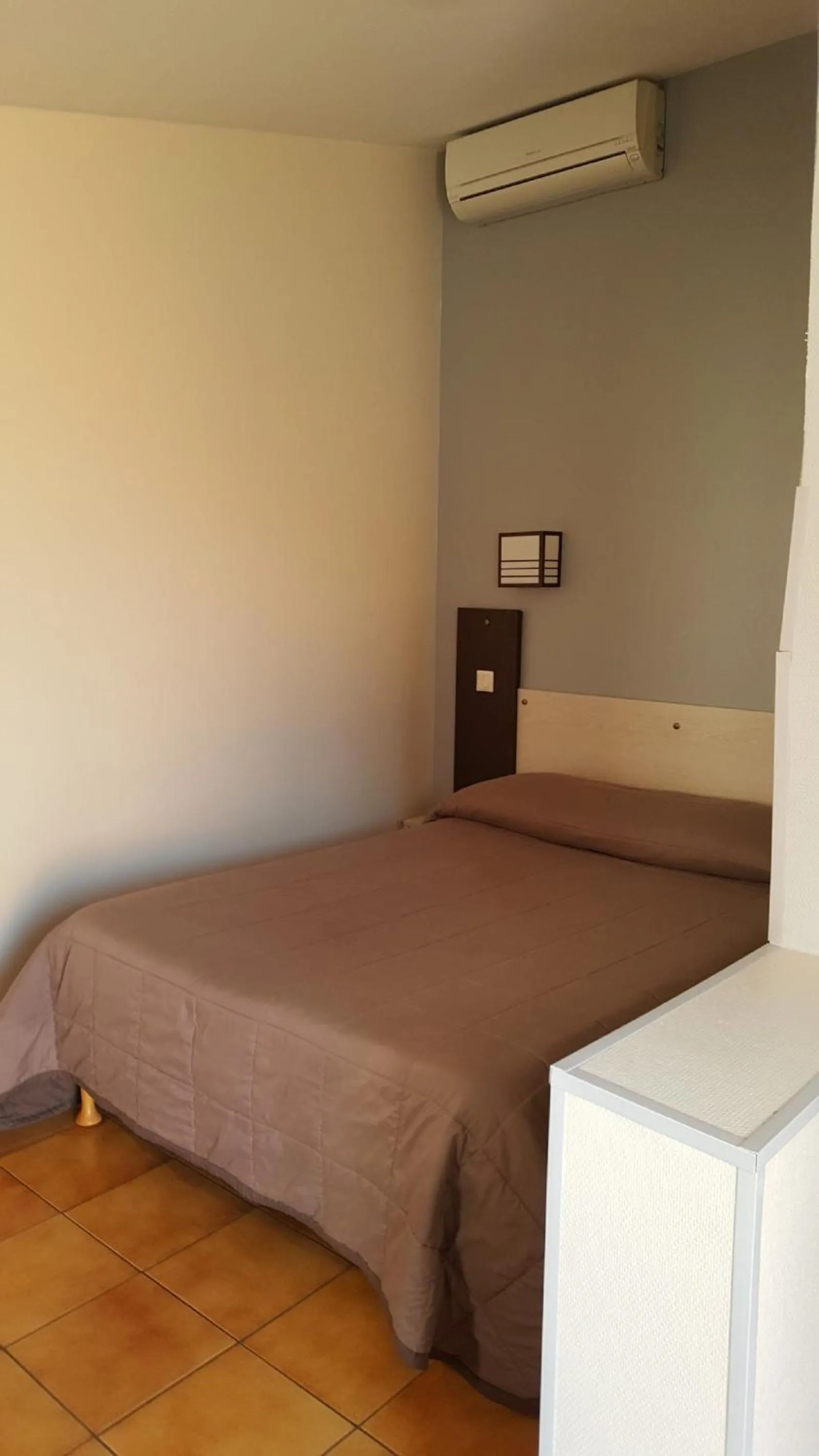 Bed in Hôtel L'Hacienda