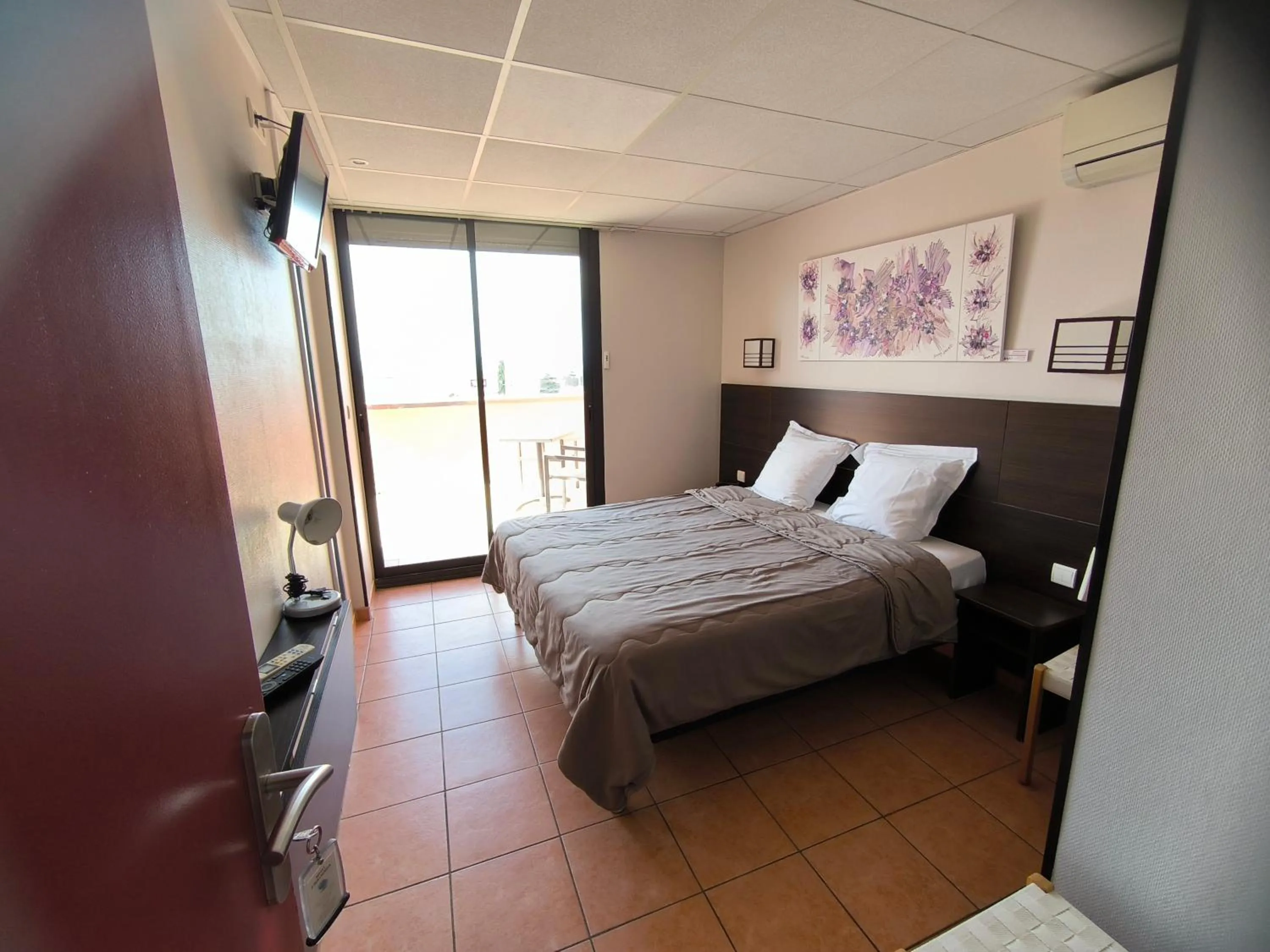 Bed in Hôtel L'Hacienda