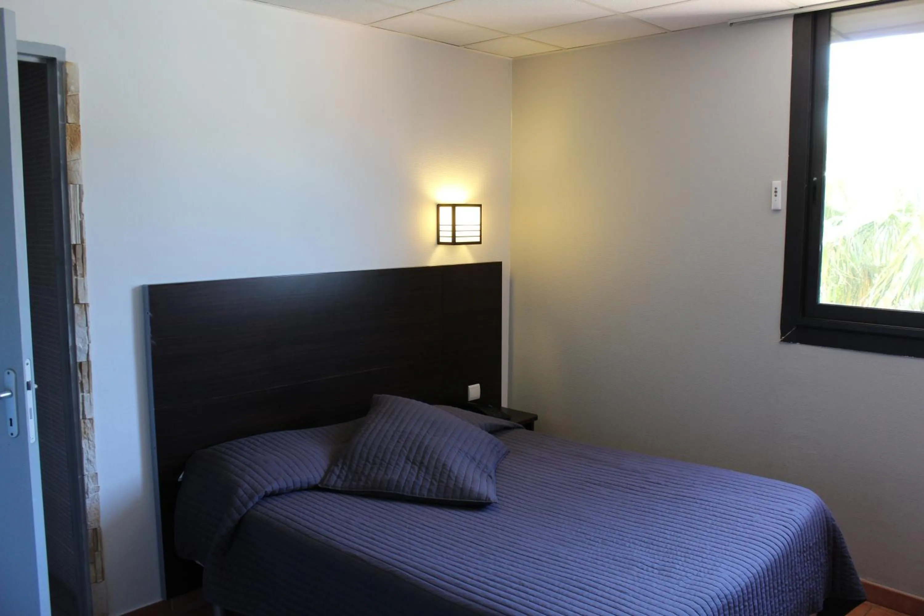 Bed in Hôtel L'Hacienda