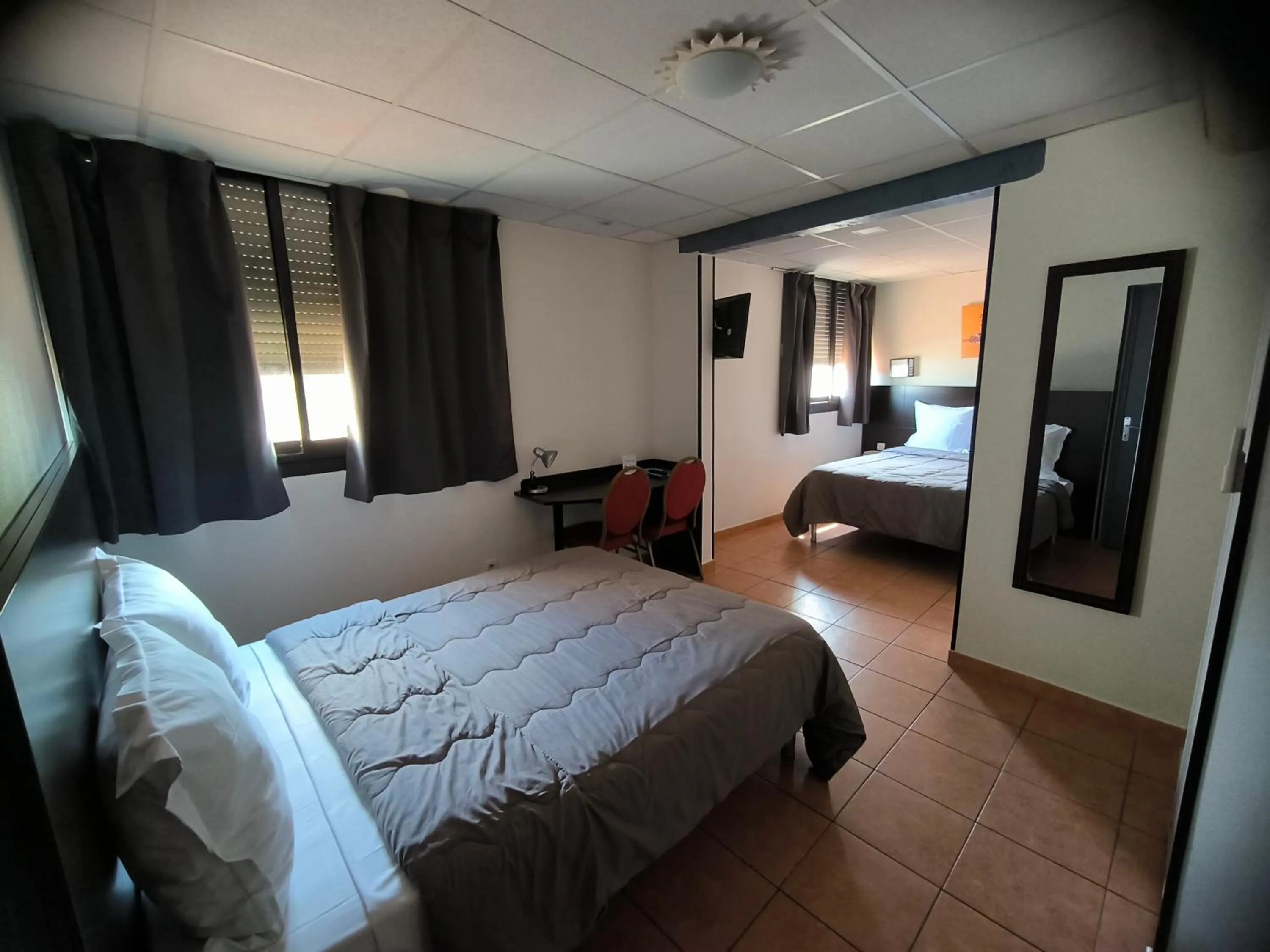 Bed in Hôtel L'Hacienda