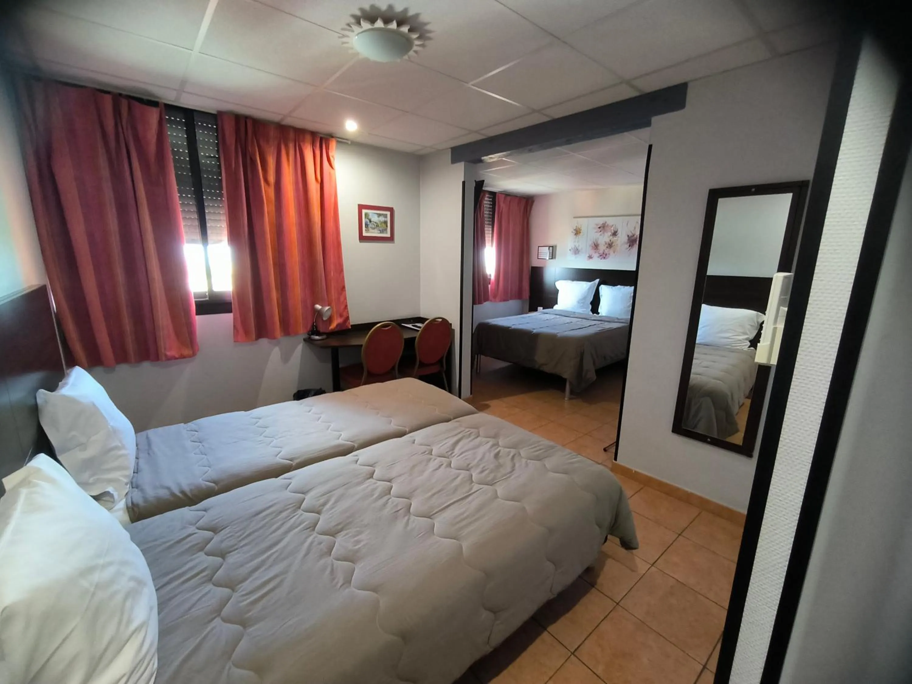 Bed in Hôtel L'Hacienda