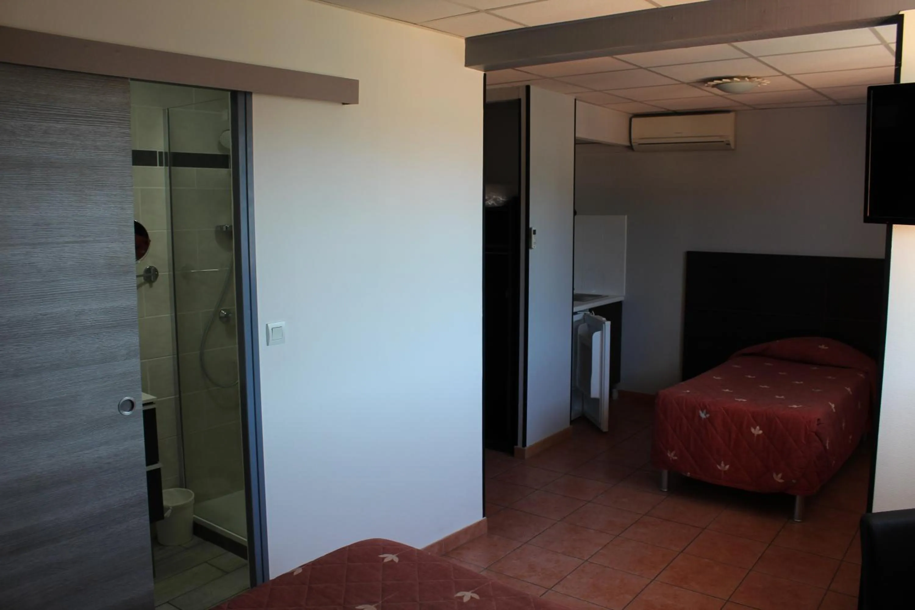 Bed in Hôtel L'Hacienda