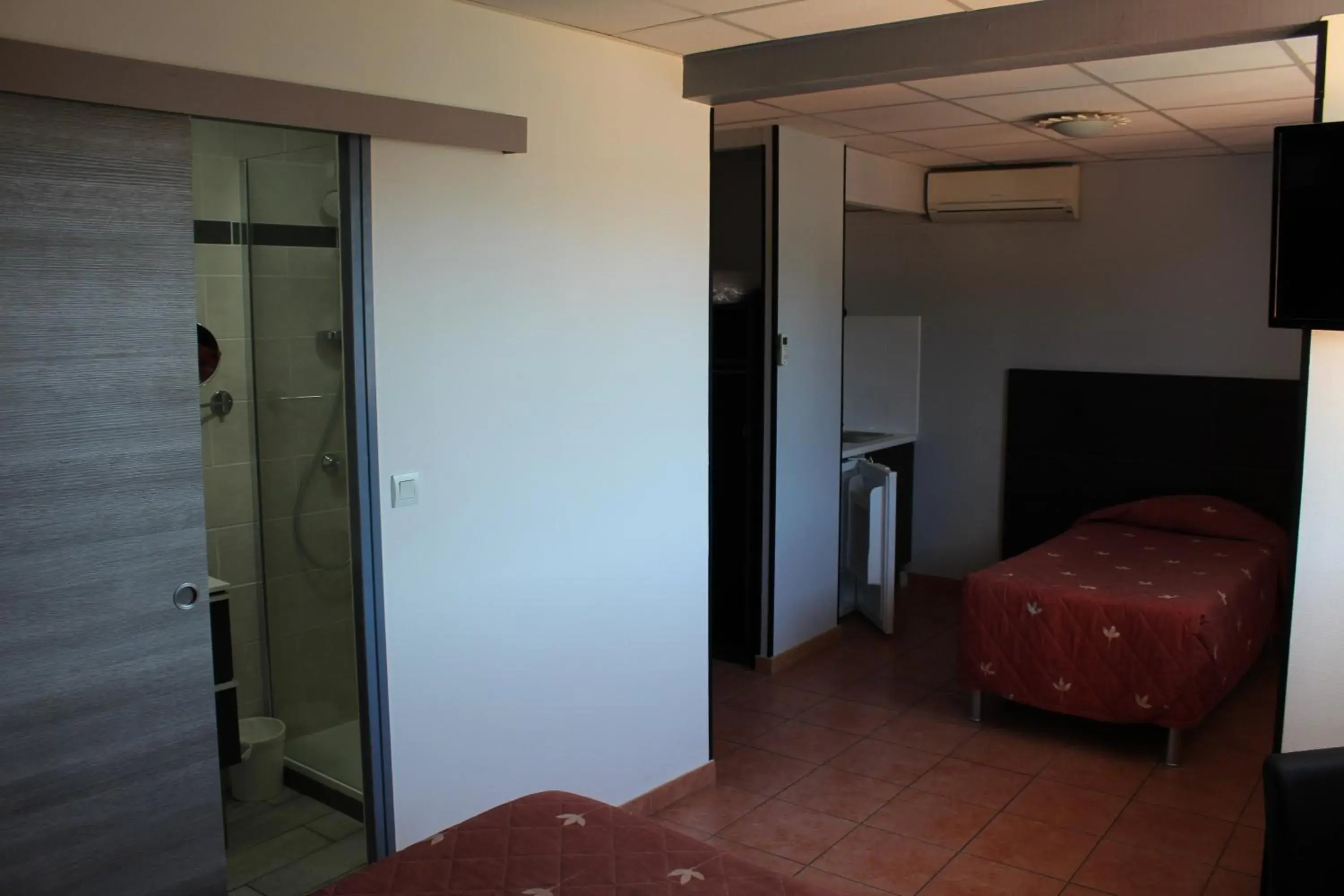 Bed in Hôtel L'Hacienda Bed in Hôtel L'Hacienda