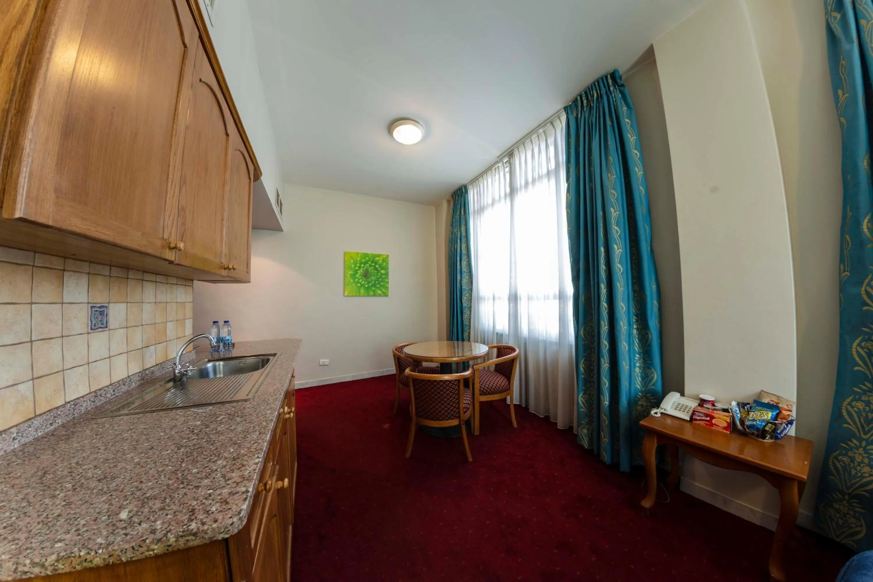 Kitchen or kitchenette in Kindi Suite Hotel