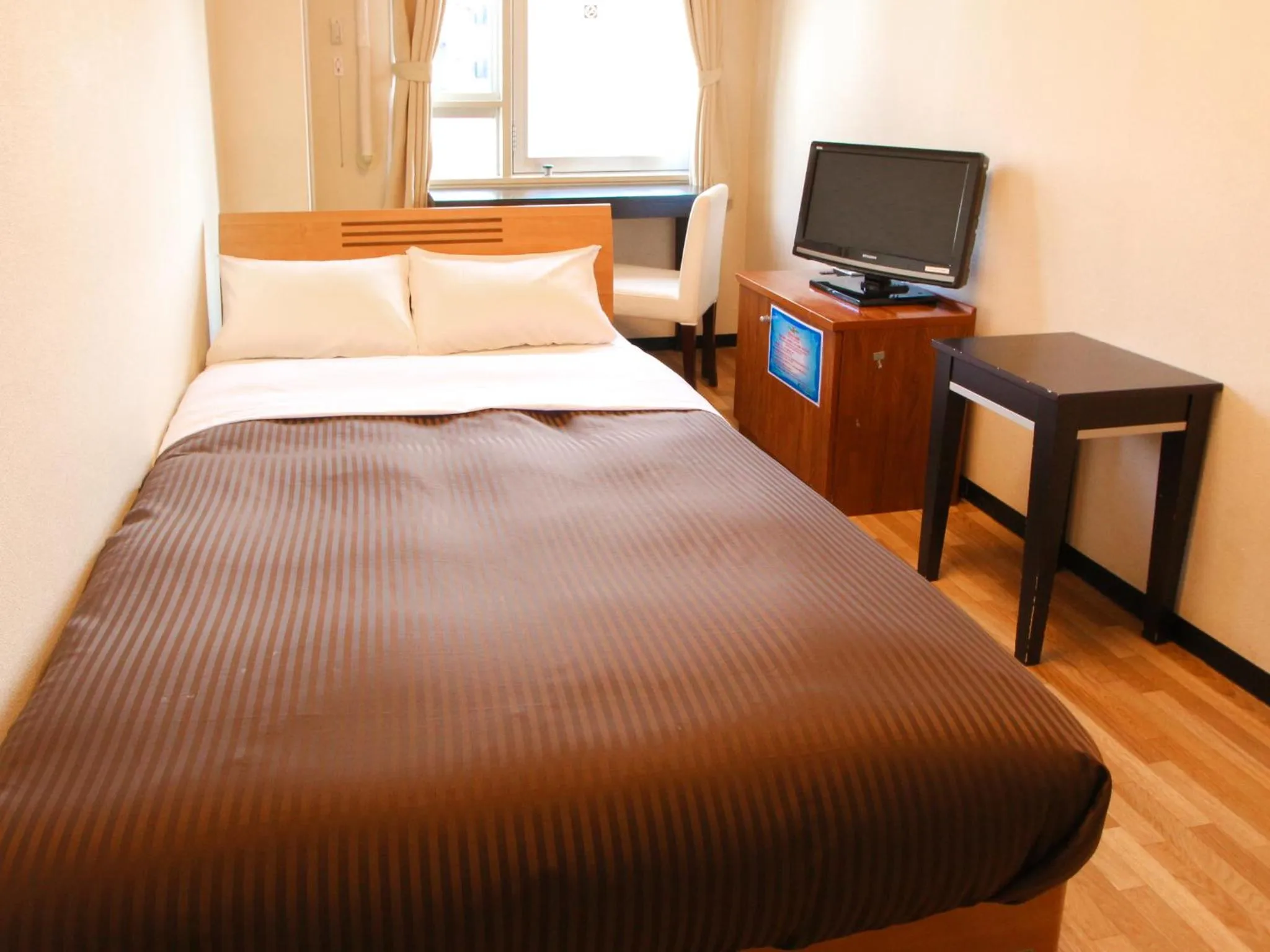 Bed in HOTEL LiVEMAX BUDGET Kawasaki Ekimae
