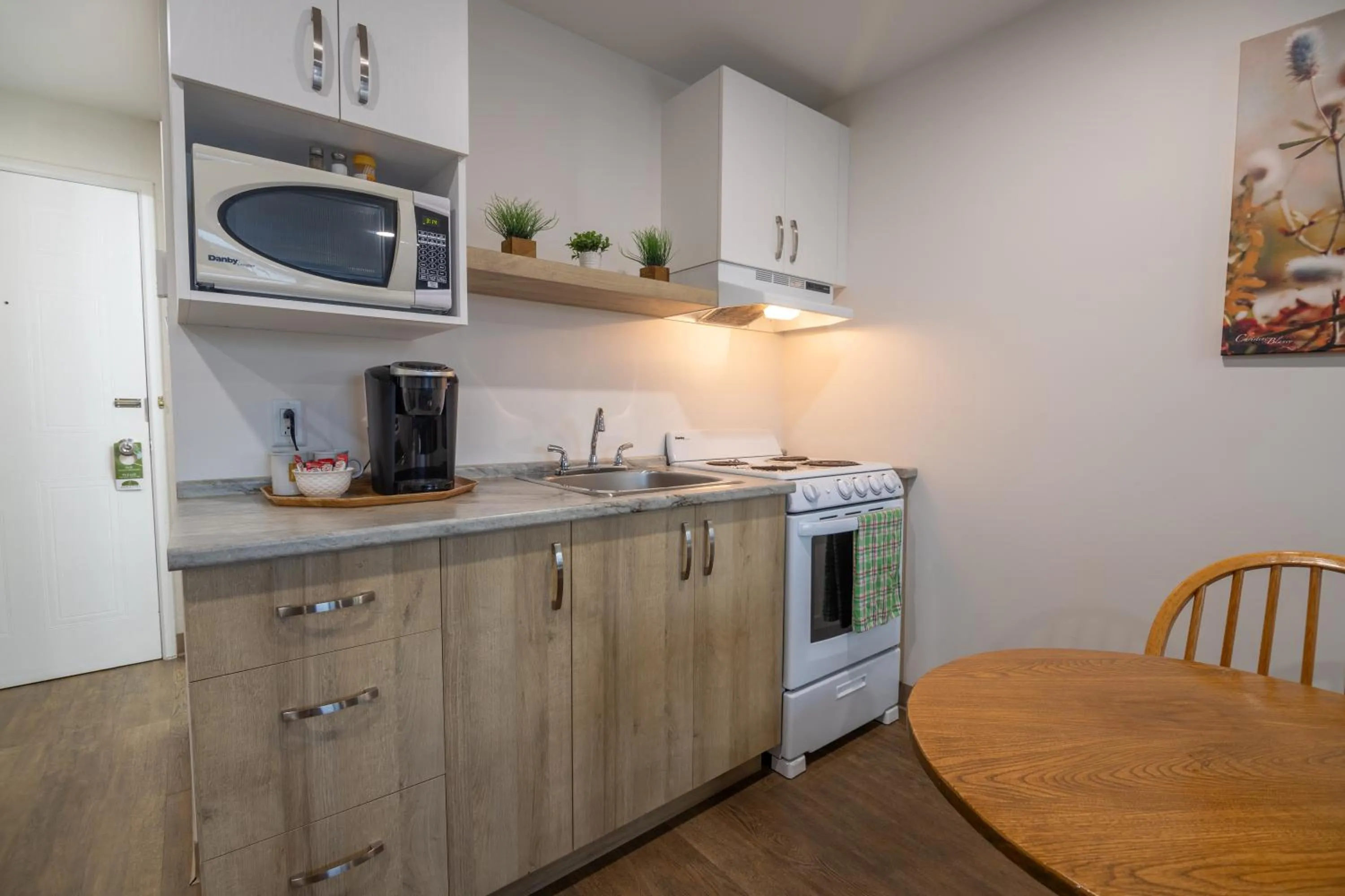 Kitchen or kitchenette in Hôtel Les Mouettes