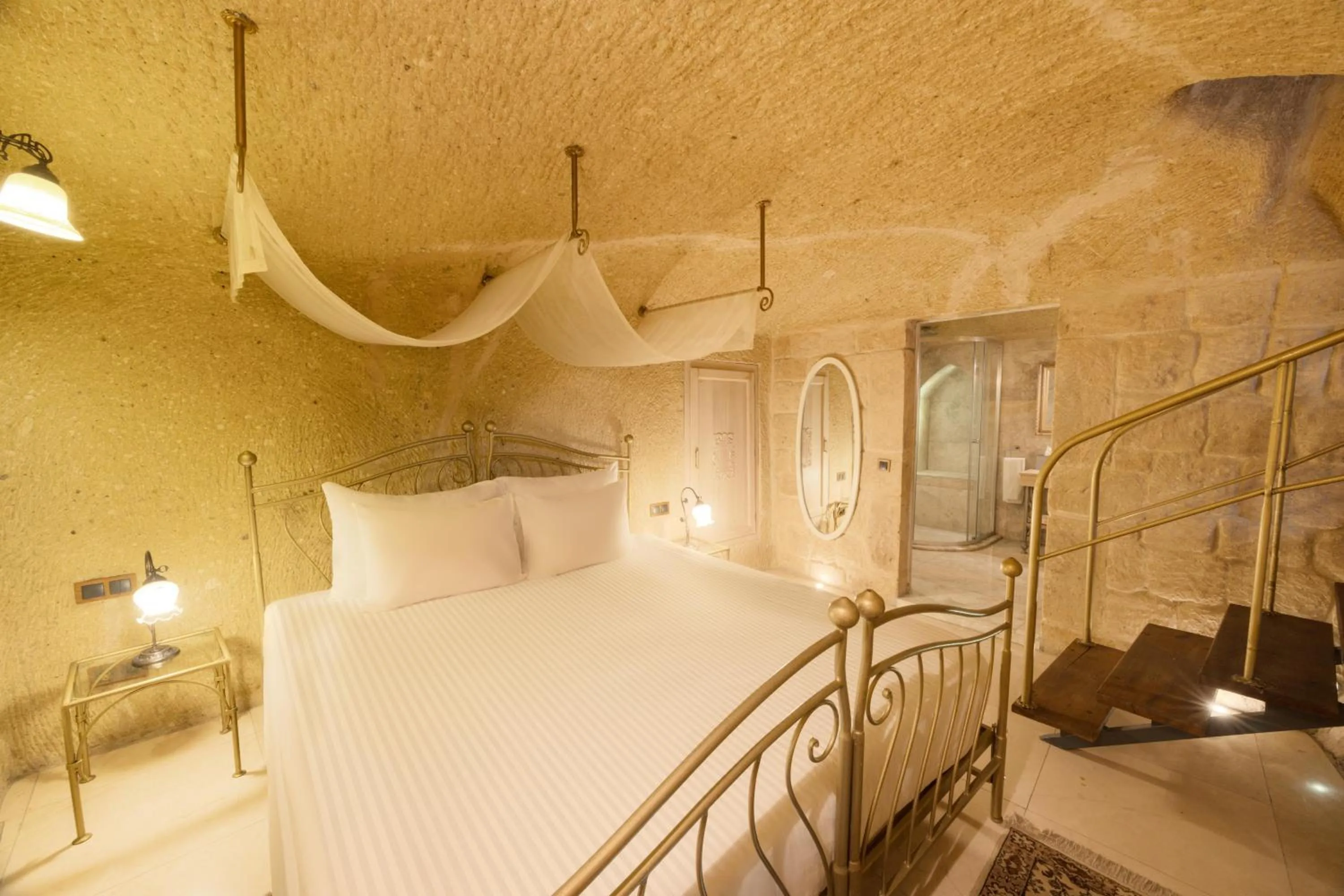 Photo of the whole room, Bed in Tafoni Houses Cave Hotel