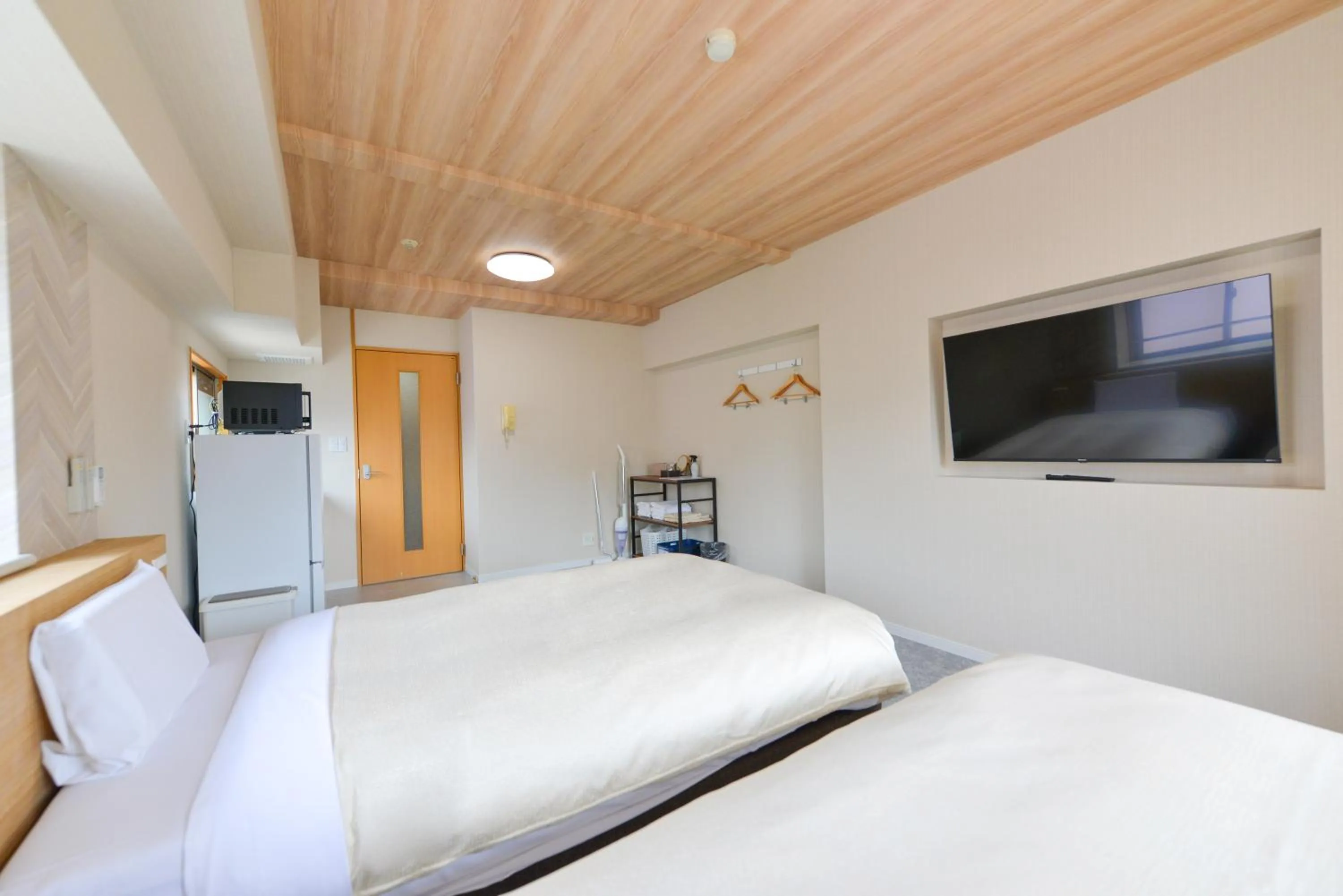 Bed in Hotel New Gaea Yakuin