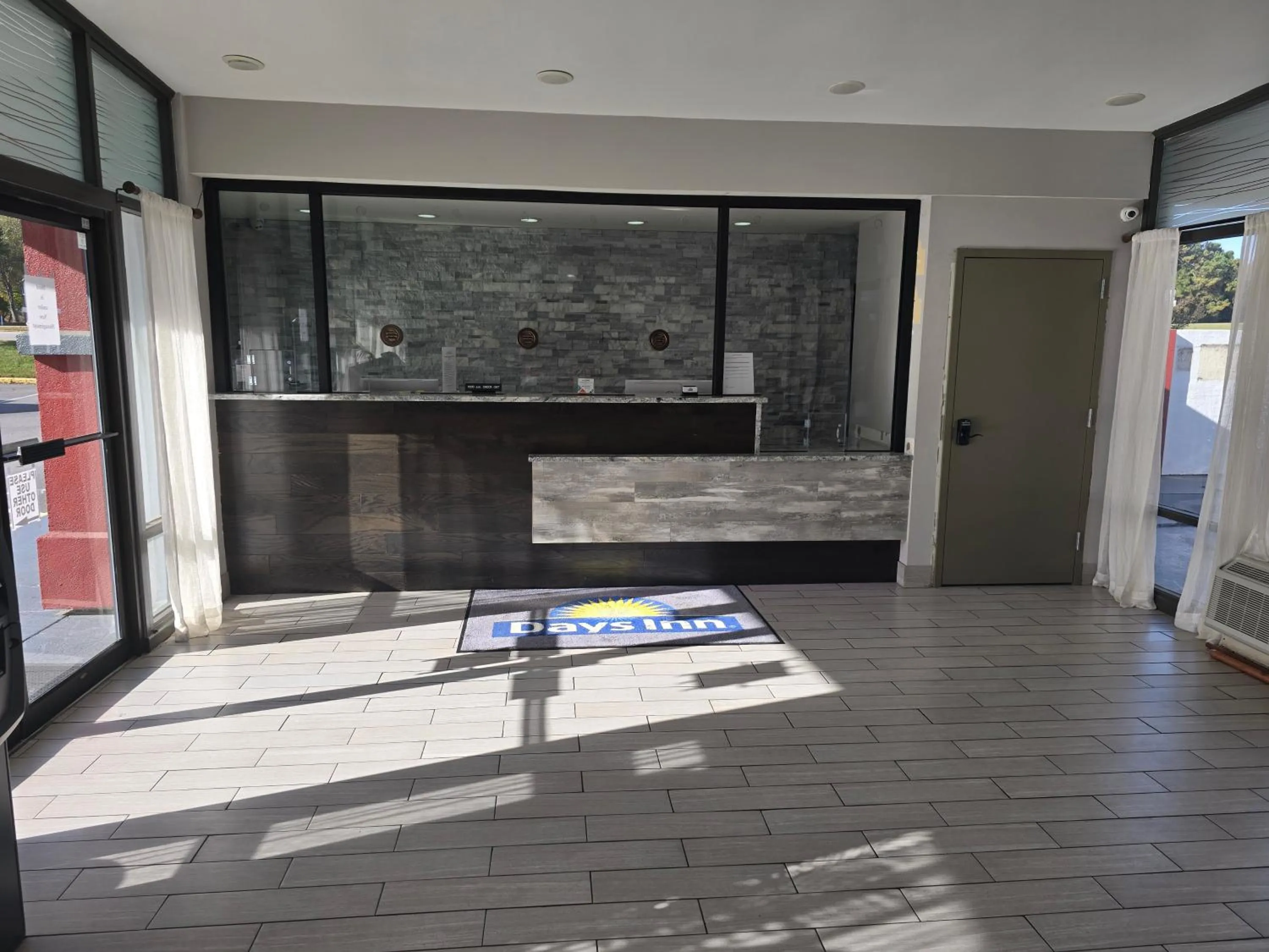 Lobby or reception in Days Inn by Wyndham Raleigh South