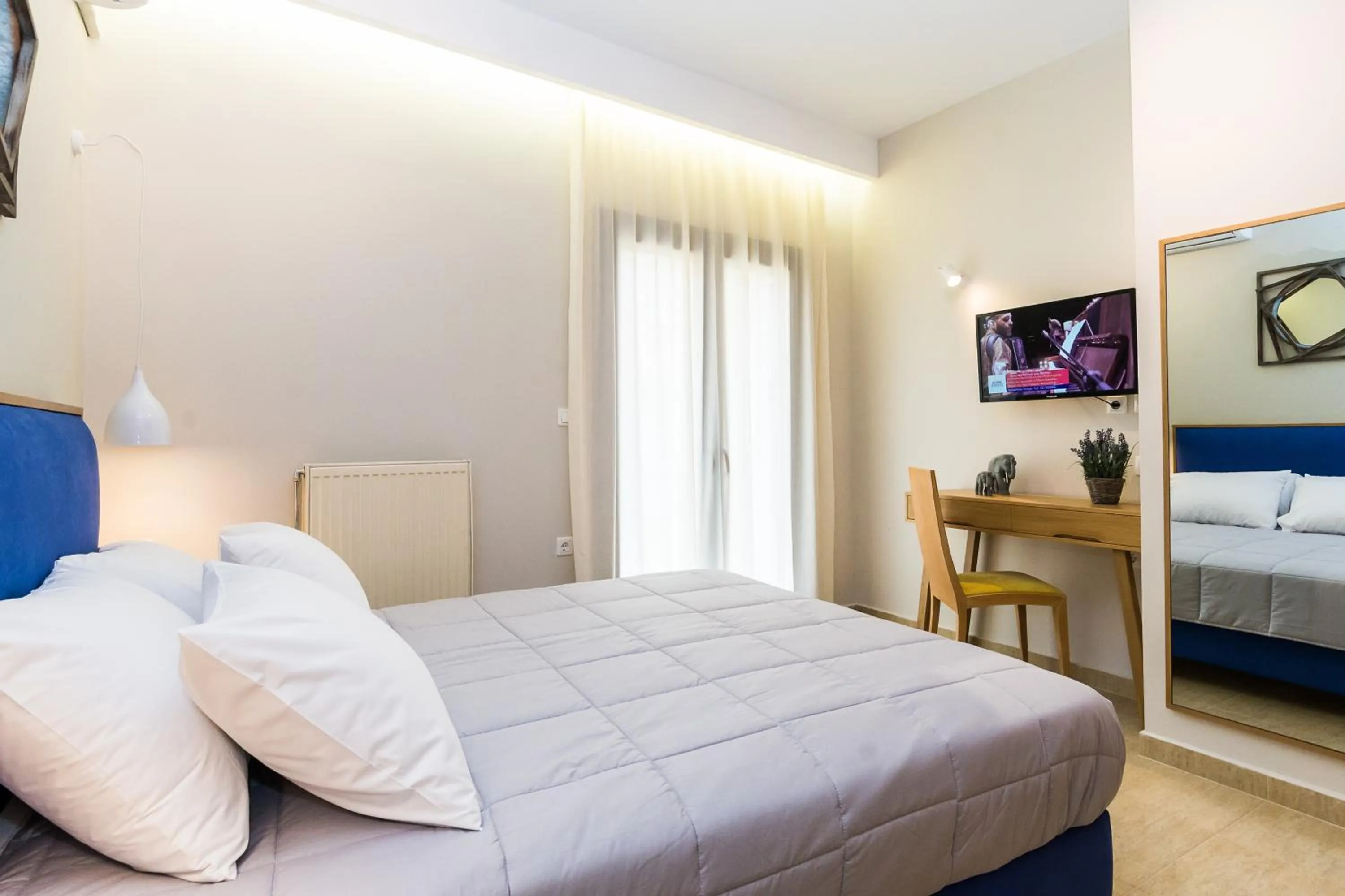 Bed in Alektor Luxury Apartments