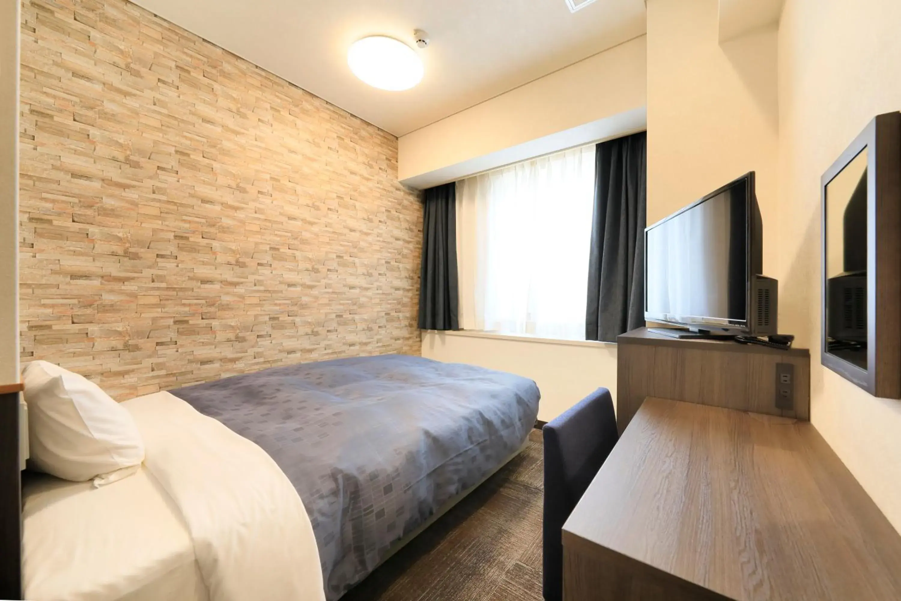 Bed in Hotel Nagano Avenue