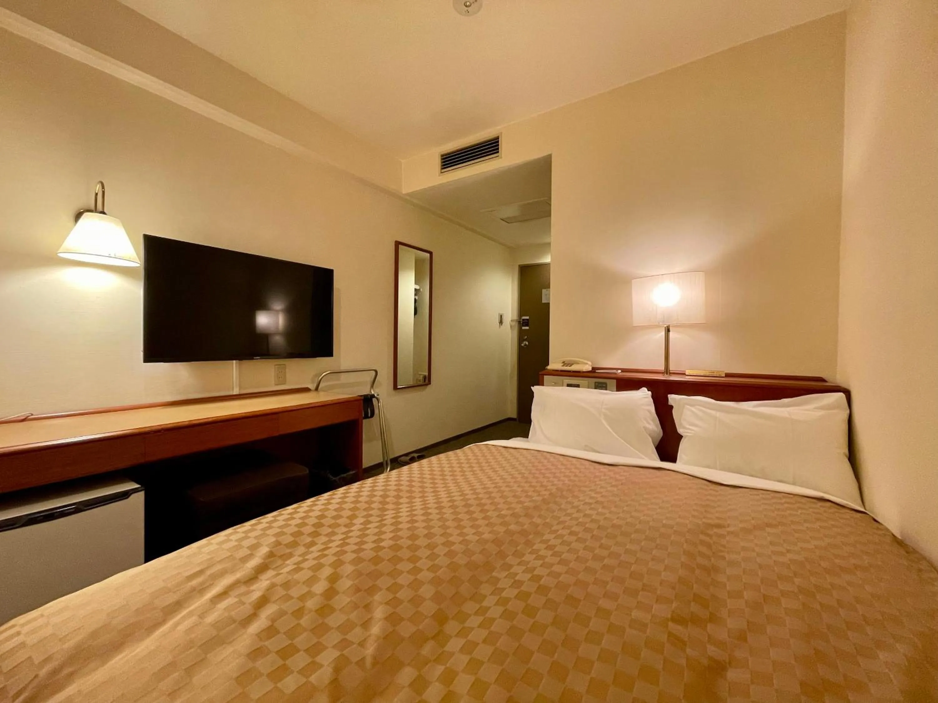 Bed in Kusatsu Daiichi Hotel