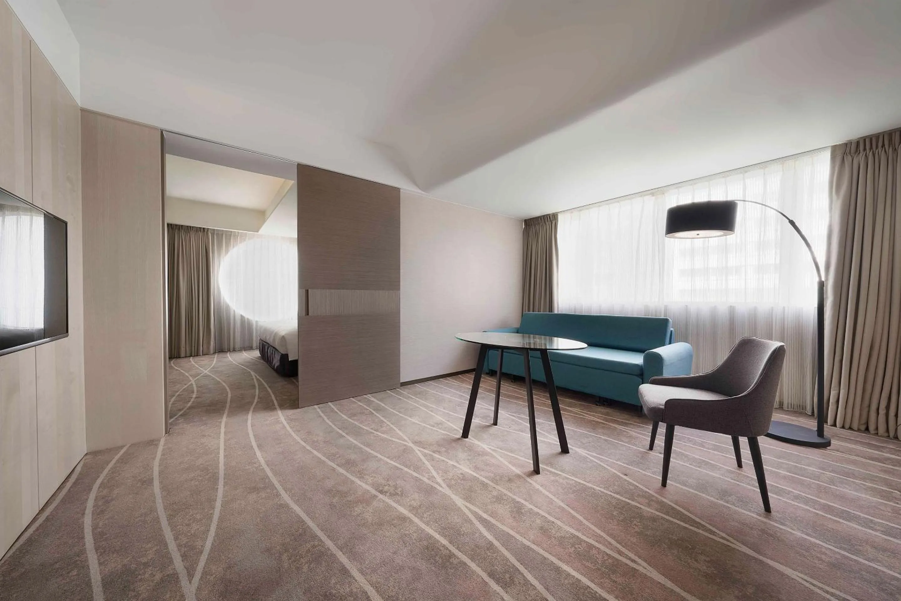 Living room, Bed in ILLUME Taipei