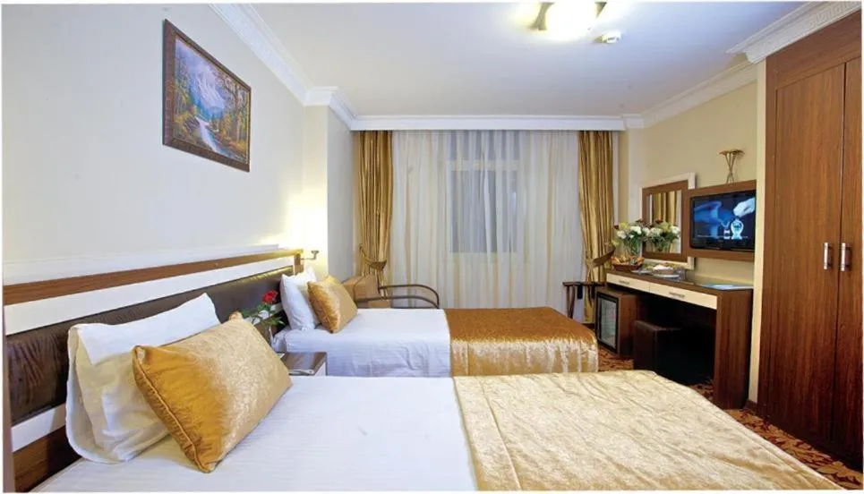 Bed in Grand Anatolia Hotel