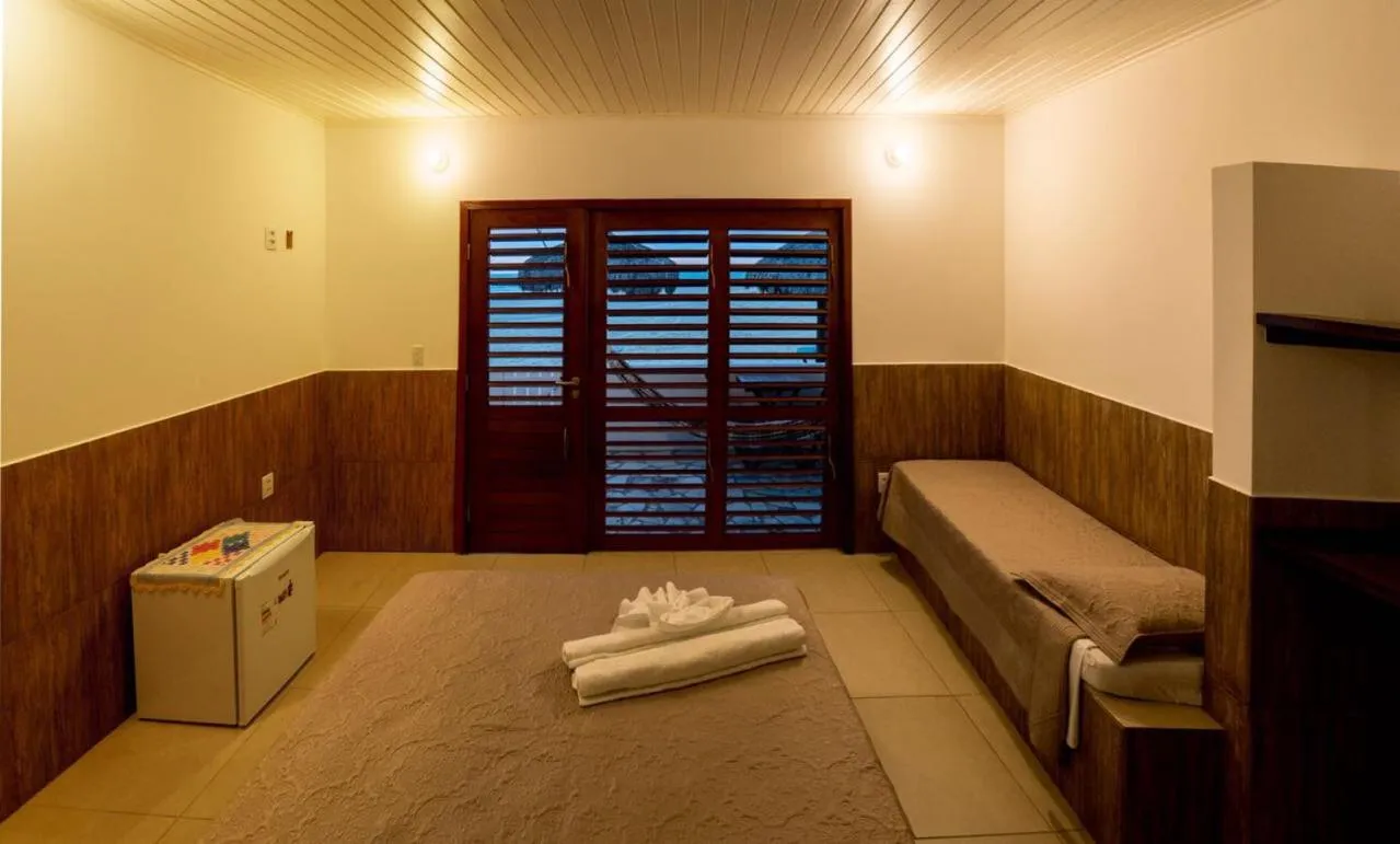 Bed in Pousada Brésil Aventure