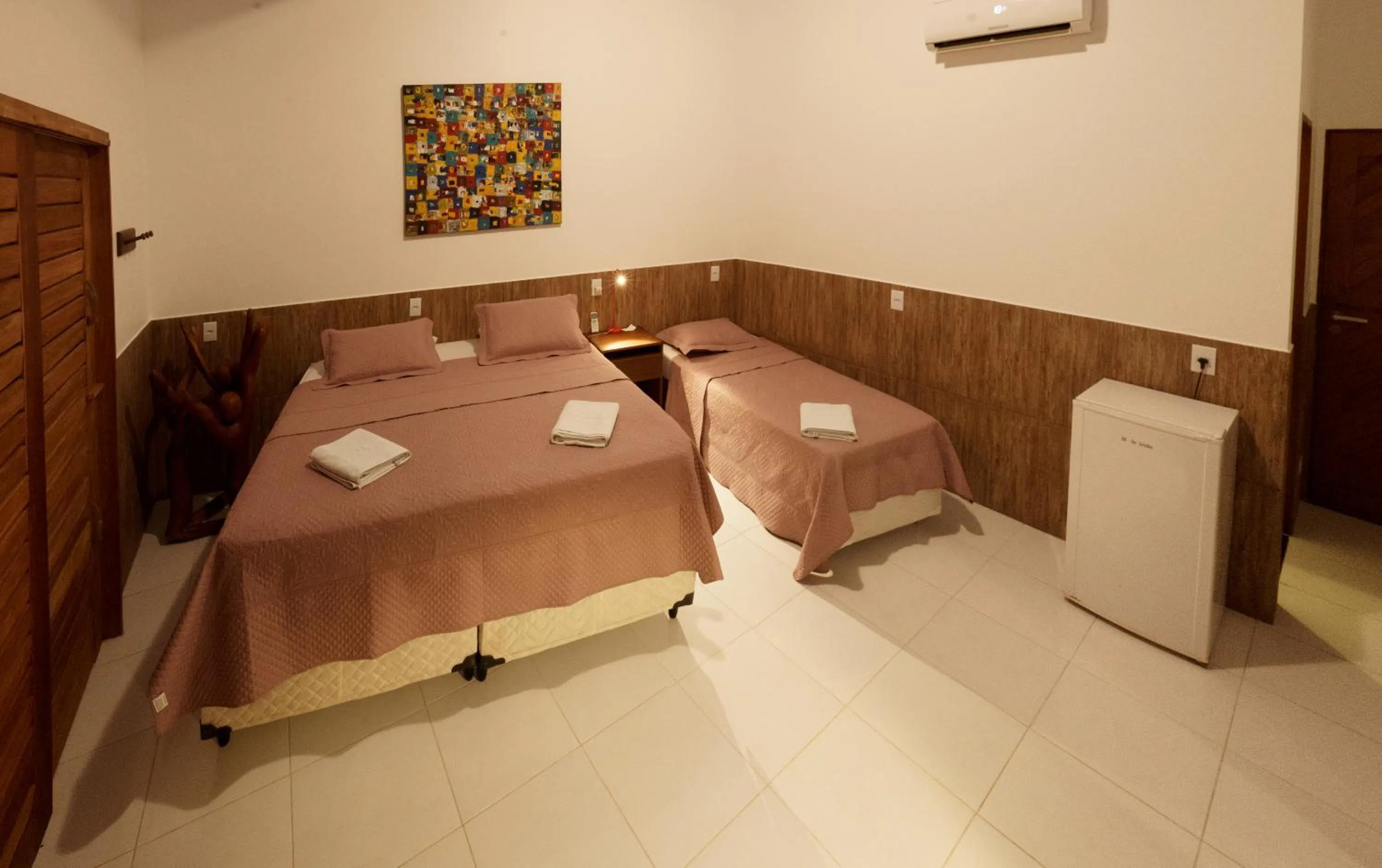 Bed in Pousada Brésil Aventure