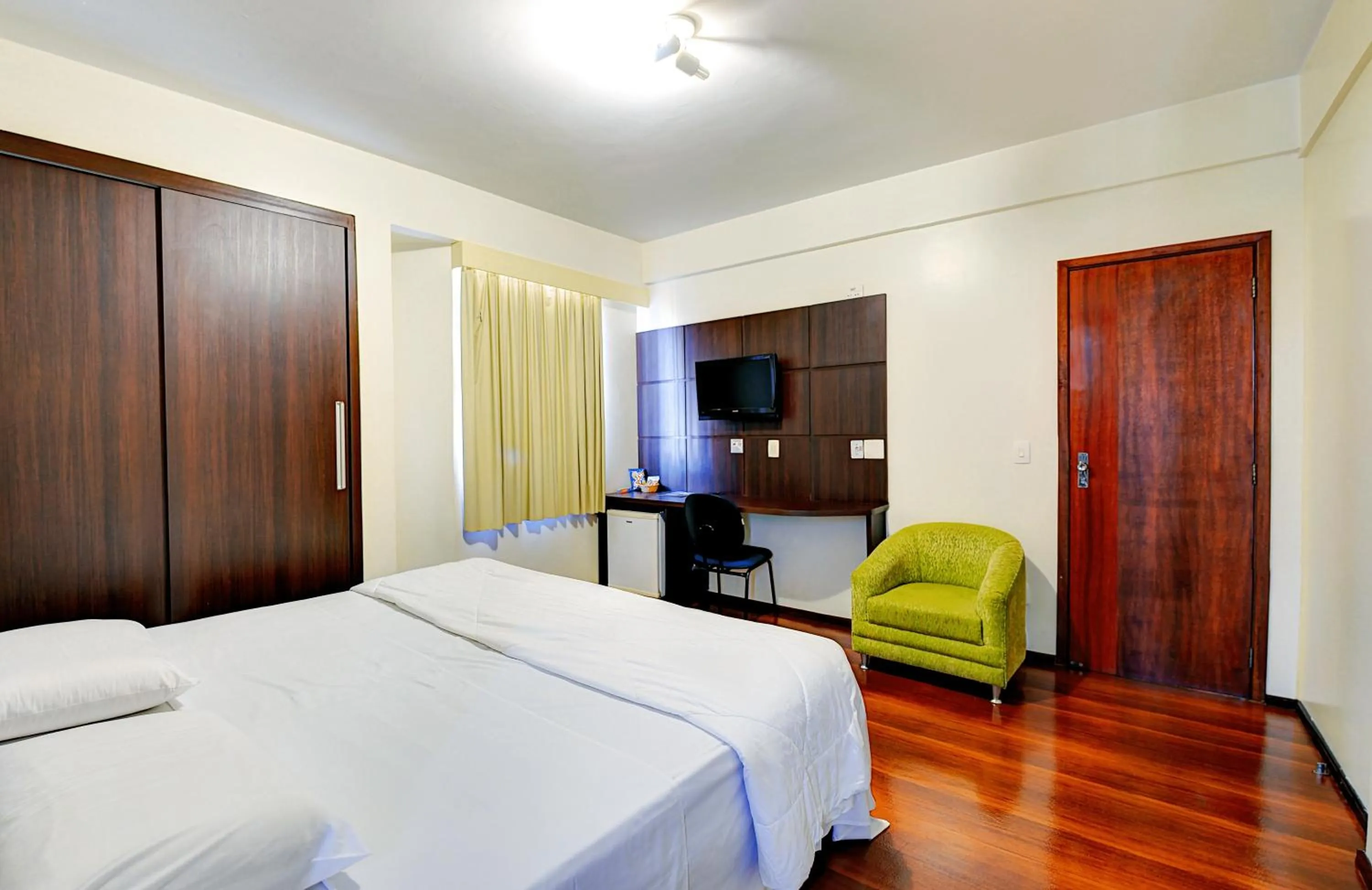 Photo of the whole room, Bed in Porto Minas Hotel e Convenções