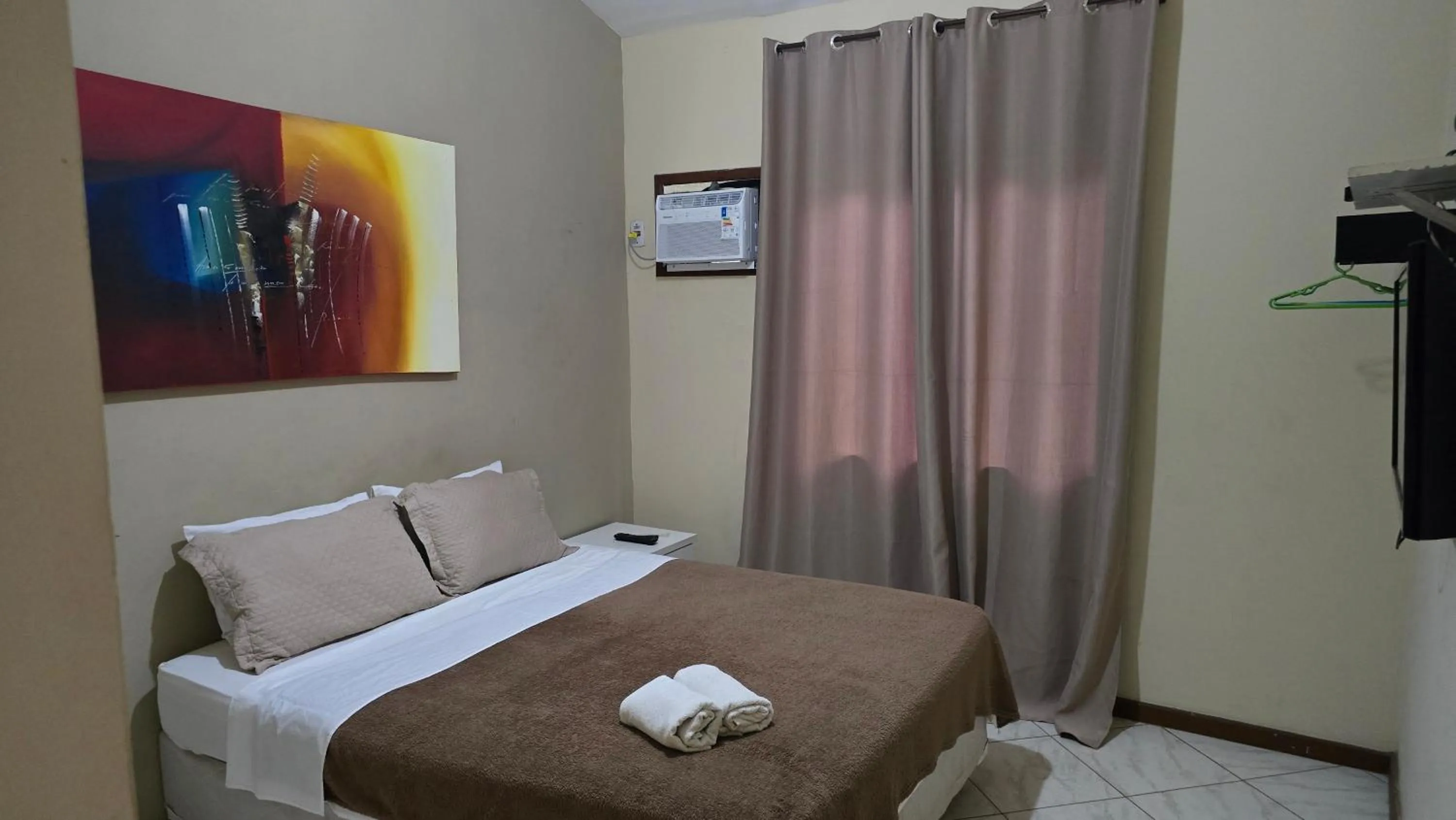 Bed in Pousada Bon Vivant