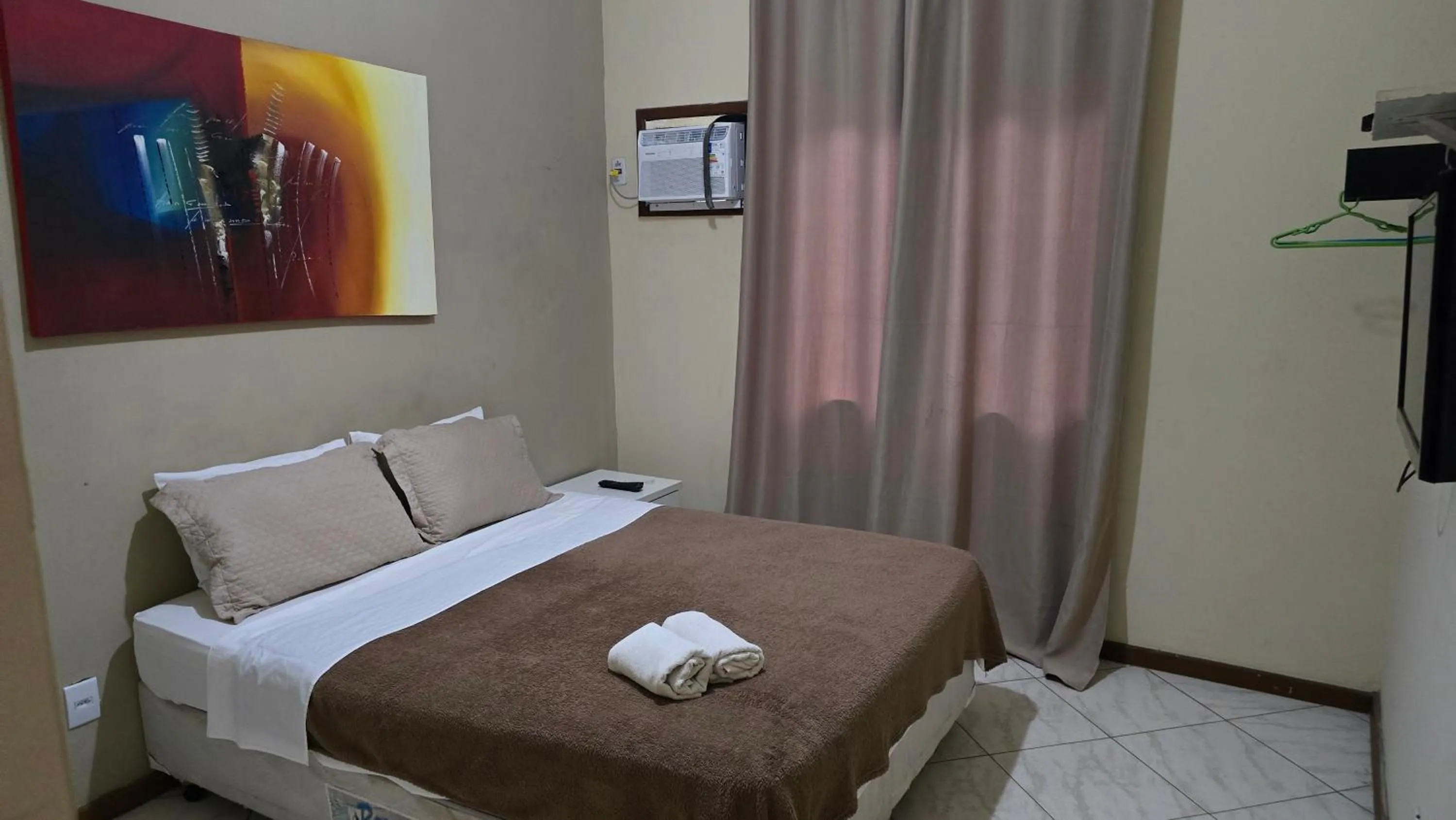 Bed in Pousada Bon Vivant