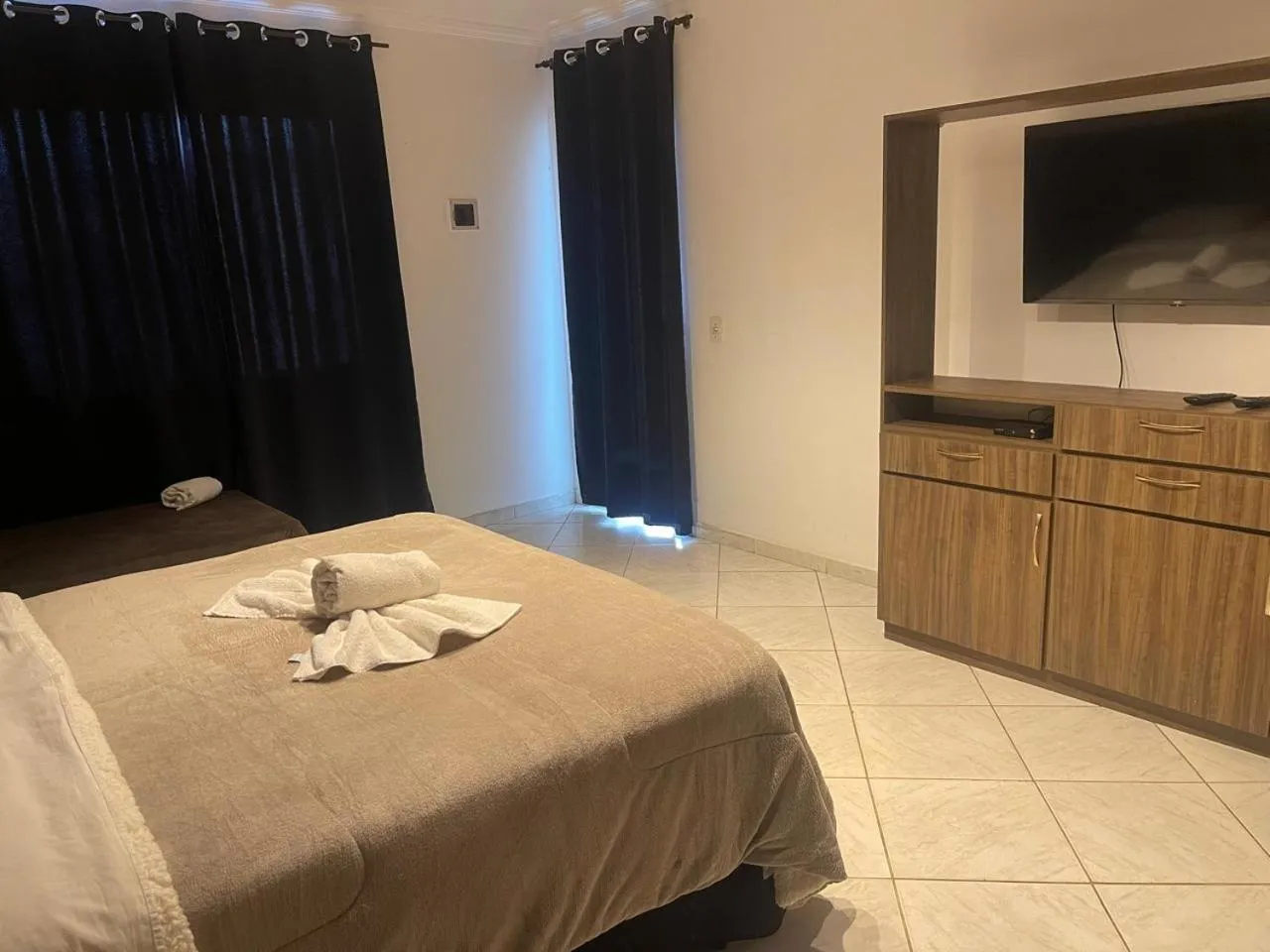 Bed in Pousada Bon Vivant