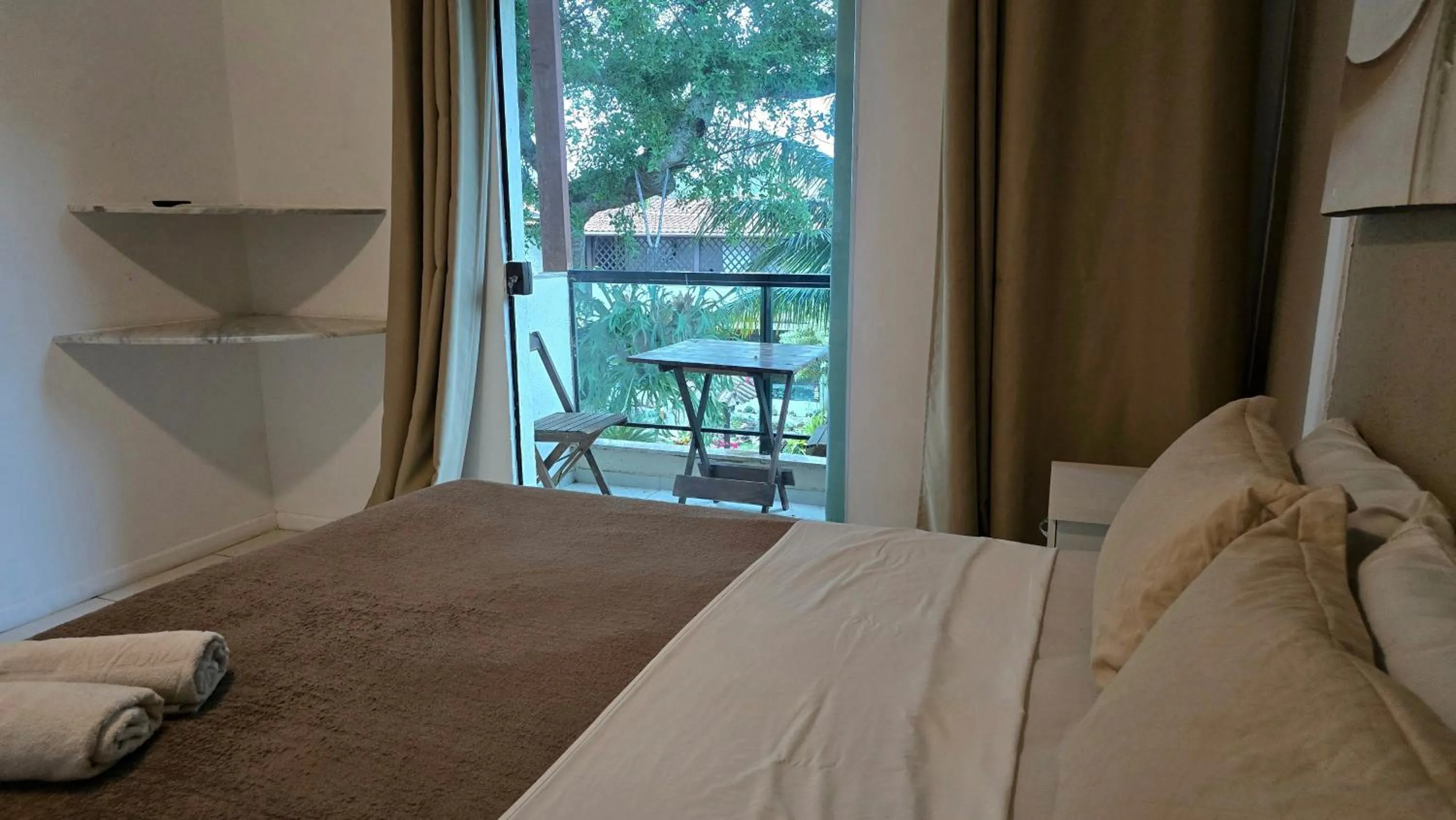 Bed in Pousada Bon Vivant