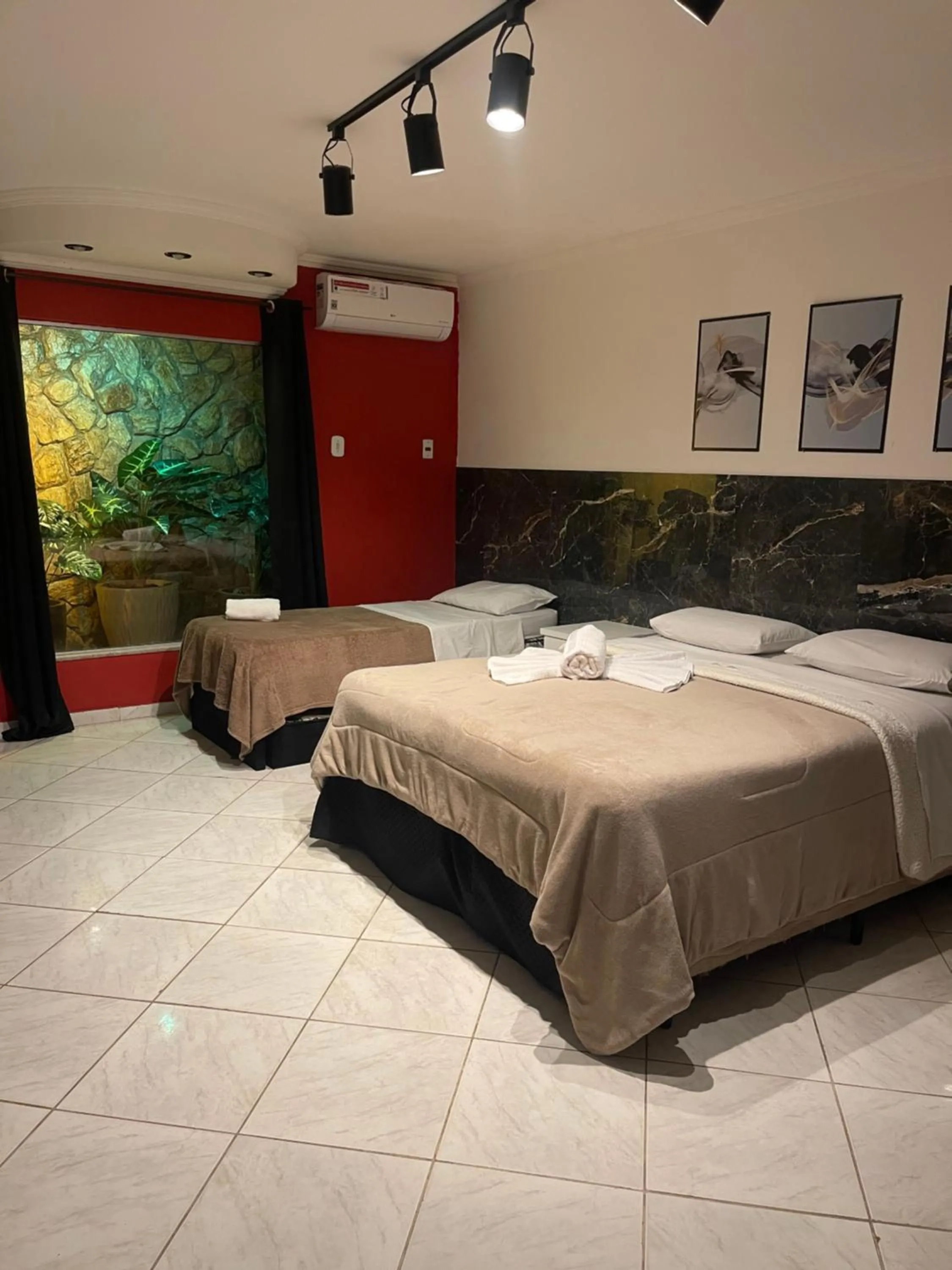 Bed in Pousada Bon Vivant