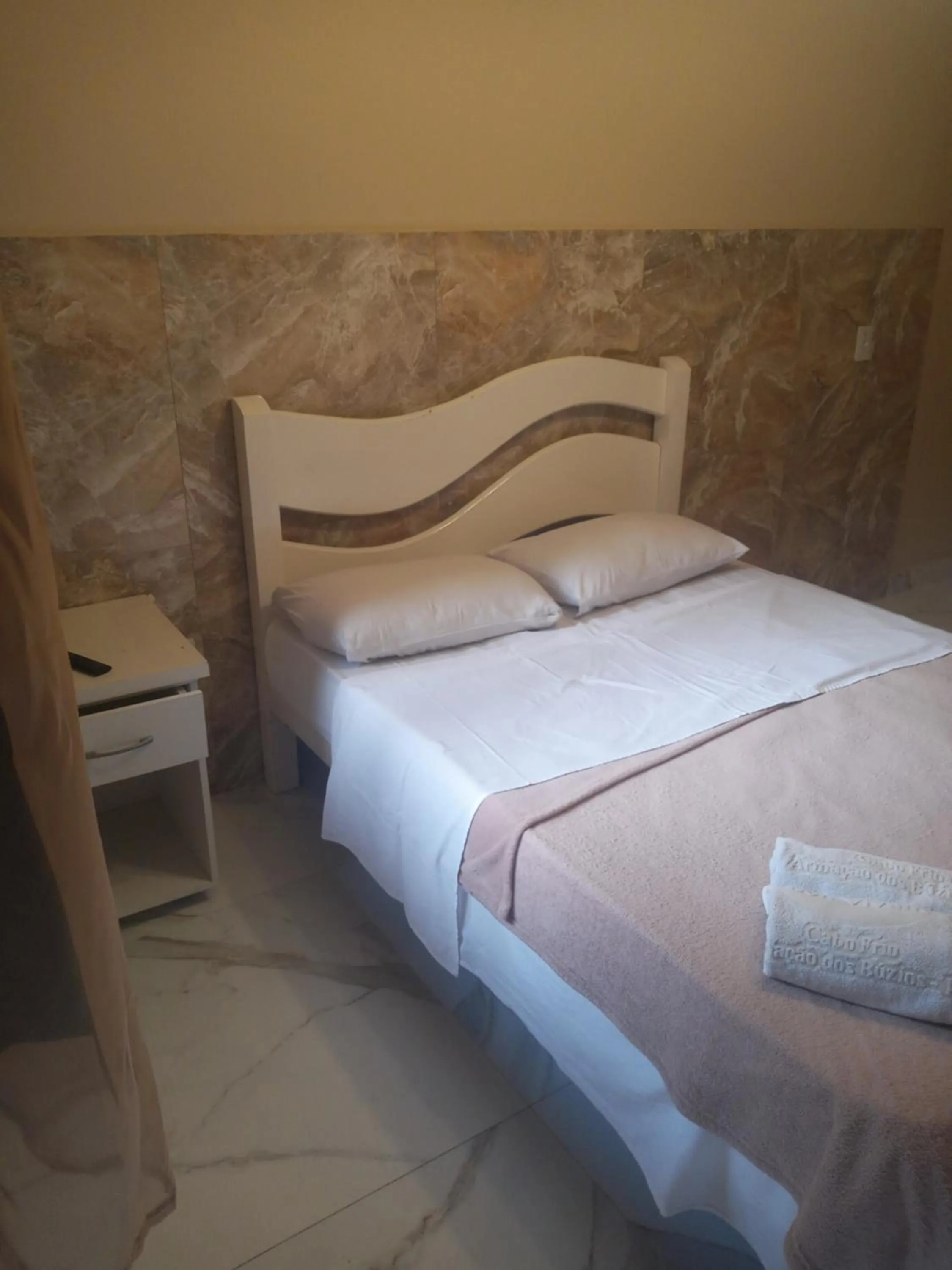 Bed in Pousada Bon Vivant